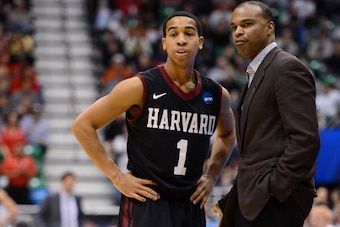 SALT LAKE CITY, UT - MARCH 21:  Head coach Tommy Amaker of the Harvard Crimson talks with Siyani Chambers #1 in the first half against the New Mexico Lobos during the second round of the 2013 NCAA Men's Basketball Tournament at EnergySolutions Arena on Ma