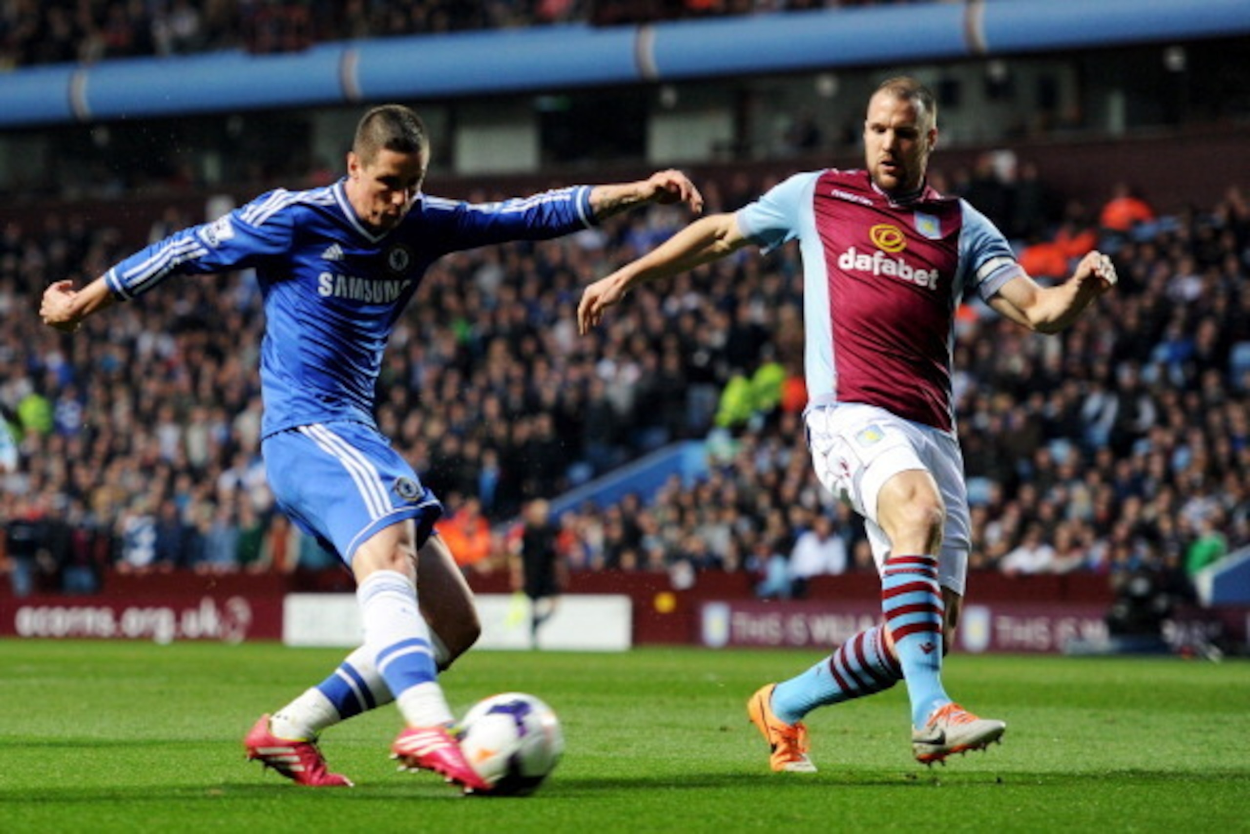 BIRMINGHAM, ENGLAND - MARCH 15:  Fernando Torres of Chelsea is blocked by Ron Vlaar of Aston Villa during the Barclays Premier League match between Aston Villa and Chelsea at Villa Park on March 15, 2014 in Birmingham, England.  (Photo by Chris Brunskill/