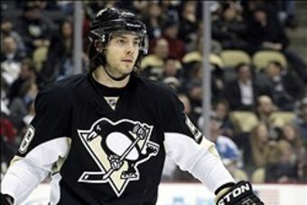 Jan 22, 2014; Pittsburgh, PA, USA; Pittsburgh Penguins defenseman Kris Letang (58) at the face-off circle against the Montreal Canadiens during the third period at the CONSOL Energy Center. The Penguins won 5-1. Mandatory Credit: Charles LeClaire-USA TODA