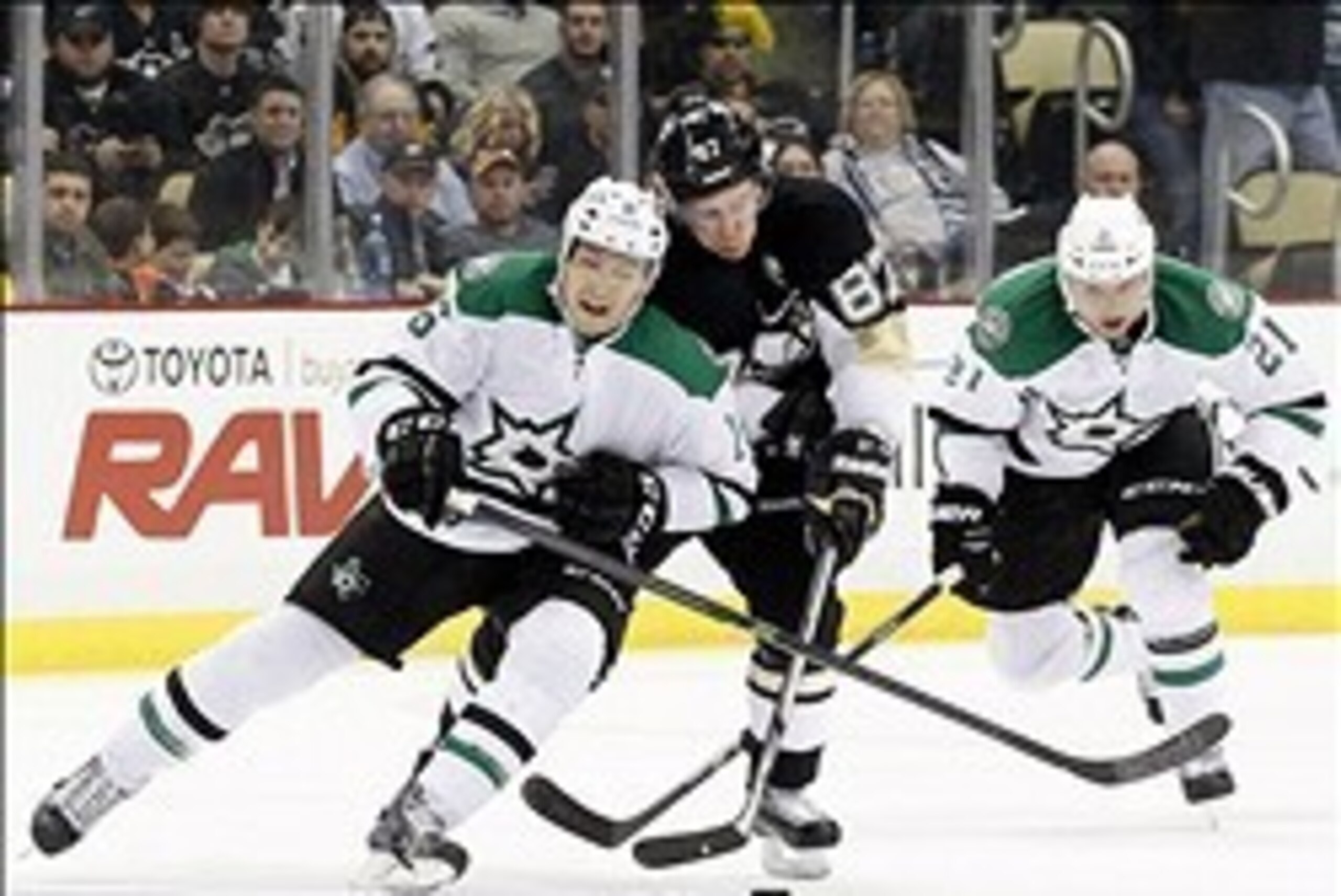 Mar 18, 2014; Pittsburgh, PA, USA; Pittsburgh Penguins center Sidney Crosby (87) chases the puck as Dallas Stars left wing Ryan Garbutt (16) and left wing Antoine Roussel (21) defend during the second period at the CONSOL Energy Center. Mandatory Credit: Mar 18, 2014; Pittsburgh, PA, USA; Pittsburgh Penguins center Sidney Crosby (87) chases the puck as Dallas Stars left wing Ryan Garbutt (16) and left wing Antoine Roussel (21) defend during the second period at the CONSOL Energy Center. Mandatory Credit: