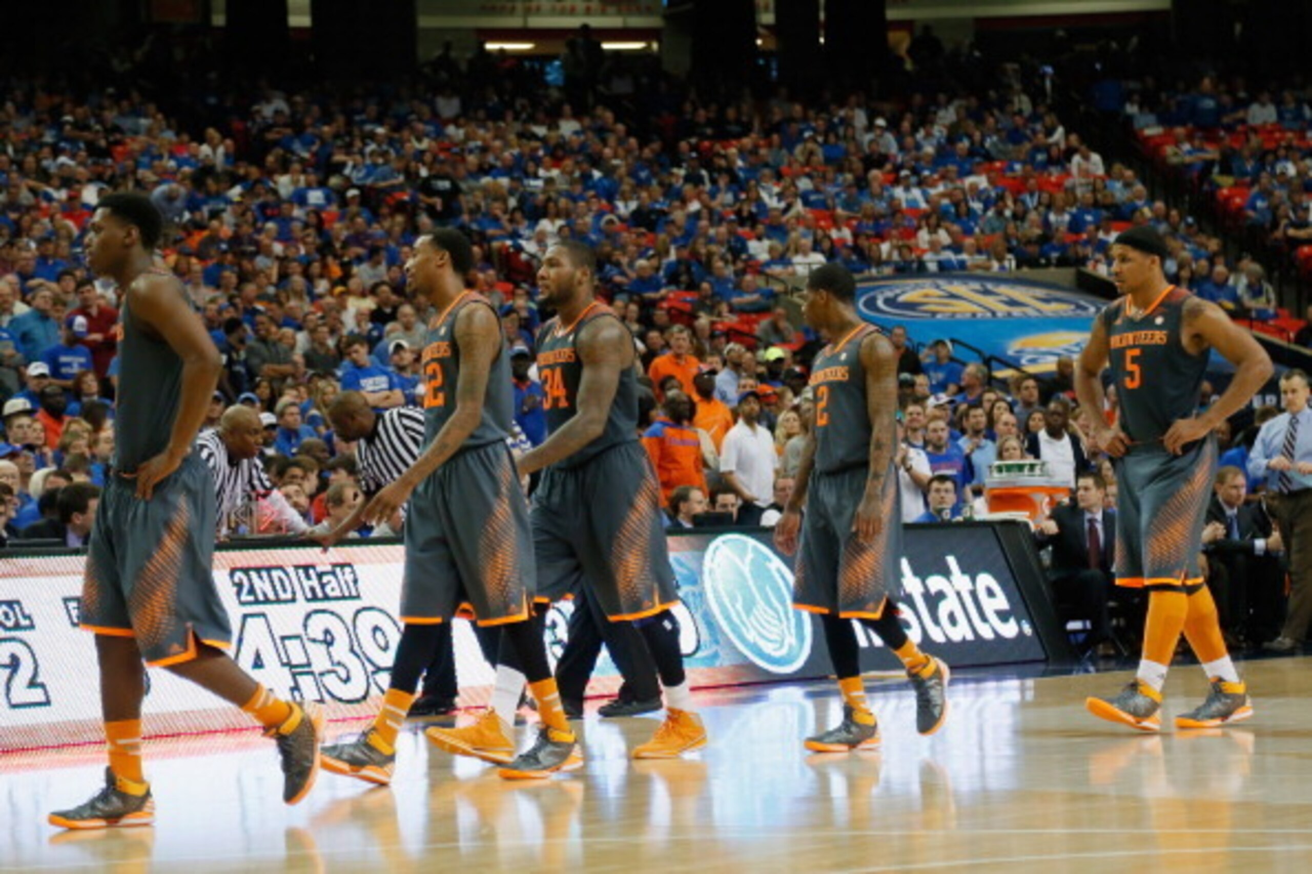 ATLANTA, GA - MARCH 15:  Jarnell Stokes #5, Jordan McRae #52, Armani Moore #4, and Jeronne Maymon #34 of the Tennessee Volunteers walk on the court after a technical foul called against Maymon during the semifinals of the SEC Men's Basketball Tournament a