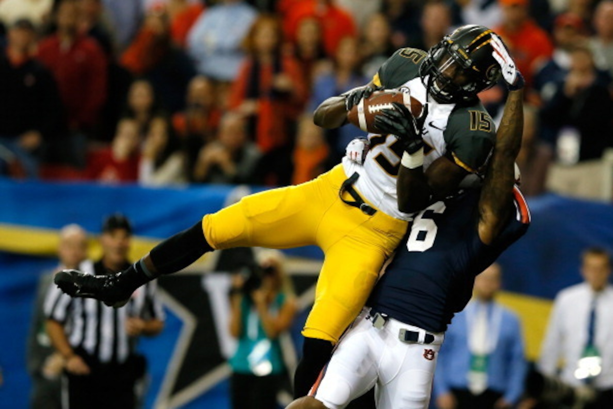 ATLANTA, GA - DECEMBER 07:  Dorial Green-Beckham #15 of the Missouri Tigers scores a touchdown in the first quarter against the Jonathon Mincy #6 of the Auburn Tigers during the SEC Championship Game at Georgia Dome on December 7, 2013 in Atlanta, Georgia