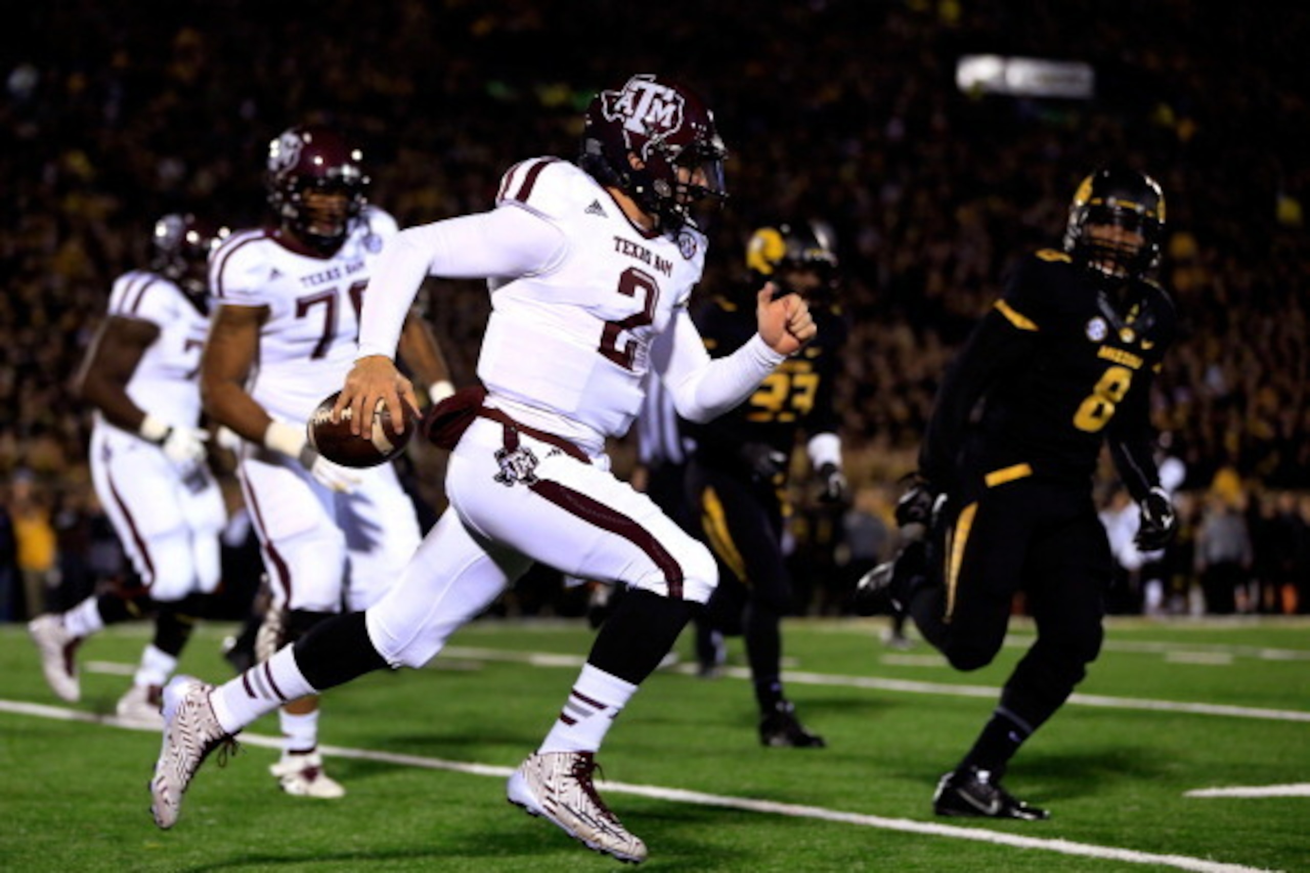 COLUMBIA, MO - NOVEMBER 30:  Quarterback Johnny Manziel #2 of the Texas A&M Aggies scrambles during the game against the Missouri Tigers on November 30, 2013 in Columbia, Missouri.  (Photo by Jamie Squire/Getty Images)