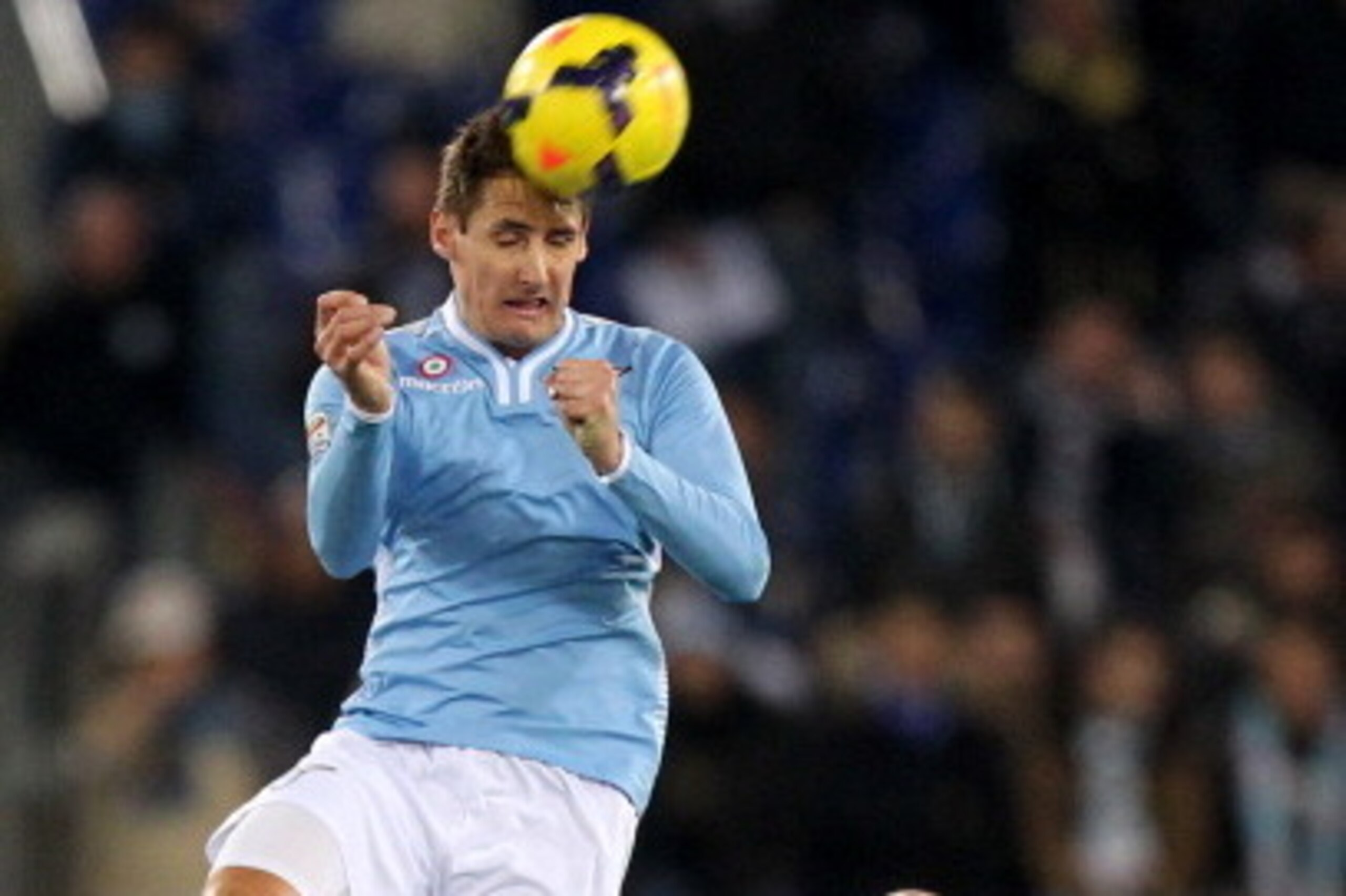 ROME, ITALY - FEBRUARY 23:  Miroslav Klose (L) of SS Lazio in action as Paolo Cannavaro of US Sassuolo Calcio watches during the Serie A match between SS Lazio and US Sassuolo Calcio at Stadio Olimpico on February 23, 2014 in Rome, Italy.  (Photo by Paolo