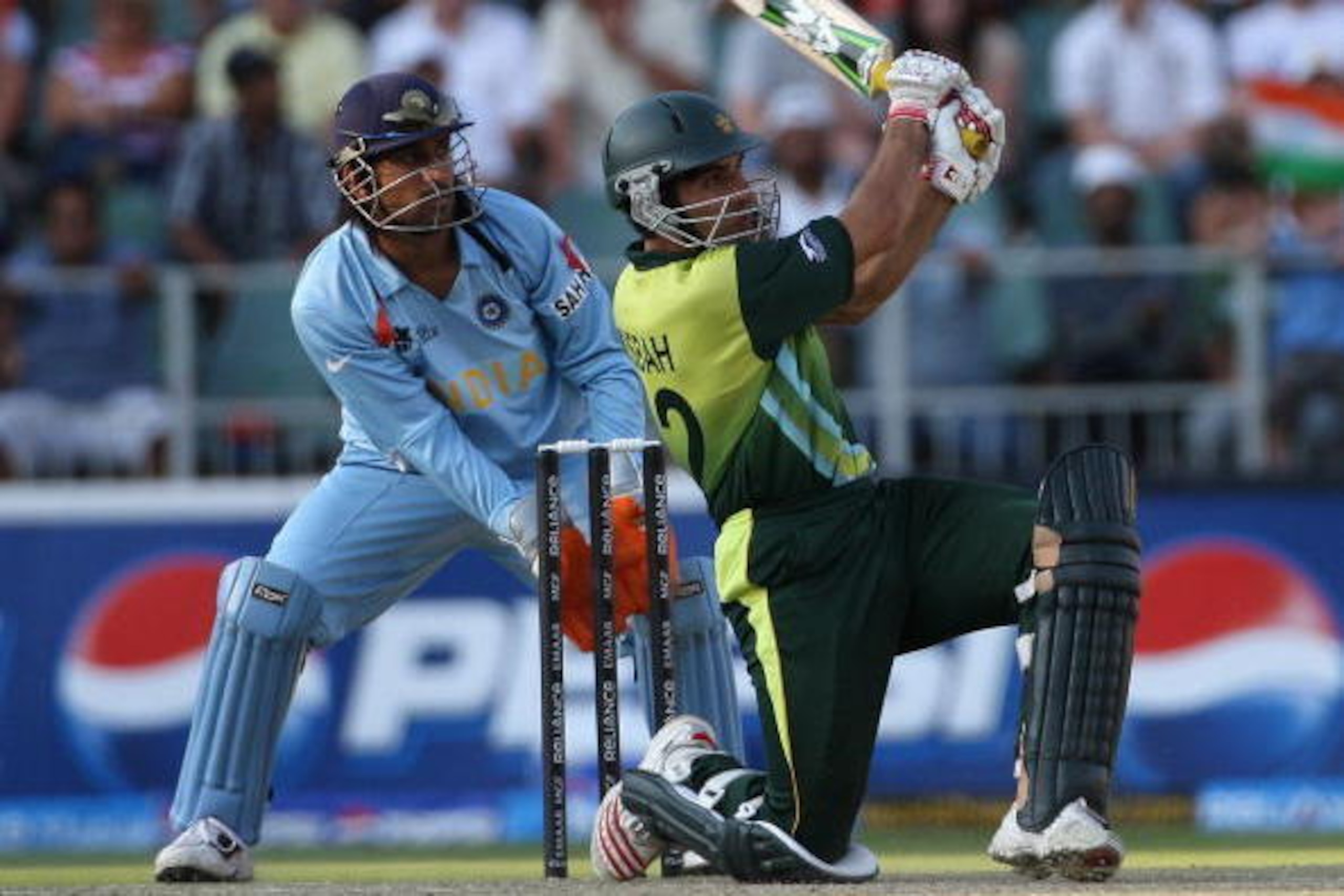 JOHANNESBURG, SOUTH AFRICA - SEPTEMBER 24:  Misbah-ul-Haq of Pakistan in action with MS Dhoni of India looking on during the Twenty20 Championship Final match between Pakistan and India at The Wanderers Stadium on September 24, 2007 in Johannesburg, South