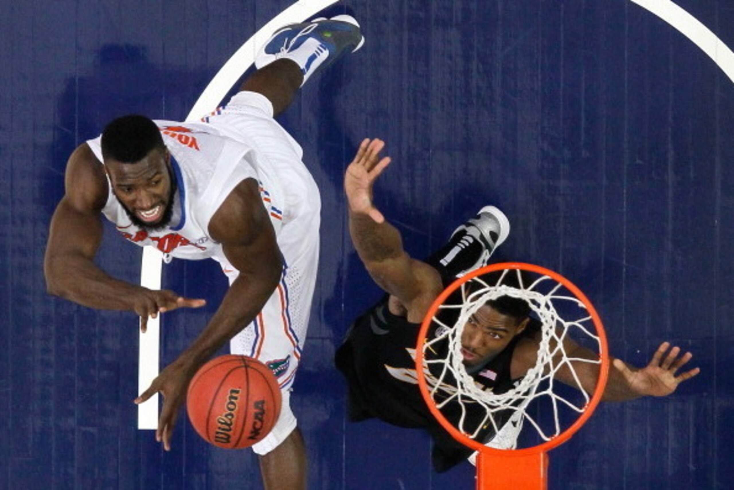 ATLANTA, GA - MARCH 14:  Patric Young #4 of the Florida Gators shoots over Torren Jones #24 of the Missouri Tigers during the quarterfinals of the SEC Men's Basketball Tournament at Georgia Dome on March 14, 2014 in Atlanta, Georgia.  (Photo by Kevin C. C