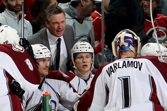 RALEIGH, NC - NOVEMBER 12: Head Coach Patrick Roy of the Colorado Avalanche talks with his goaltender Semyon Varlamov #1 during their NHL game against the Carolina Hurricanes at PNC Arena on November 12, 2013 in Raleigh, North Carolina.  (Photo by Gregg F