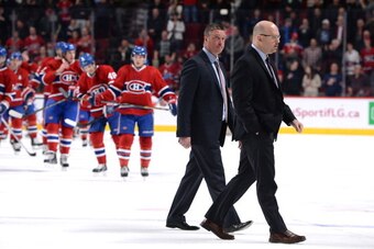 MONTREAL, CANADA - MARCH 18: Patrick Roy and Andre Tourigny after NHL game against the Montreal Canadiens of the Colorado Avalanche on March 18, 2014 at the Bell Centre in Montreal, Quebec, Canada. (Photo by Francois Lacasse/NHLI via Getty Images)