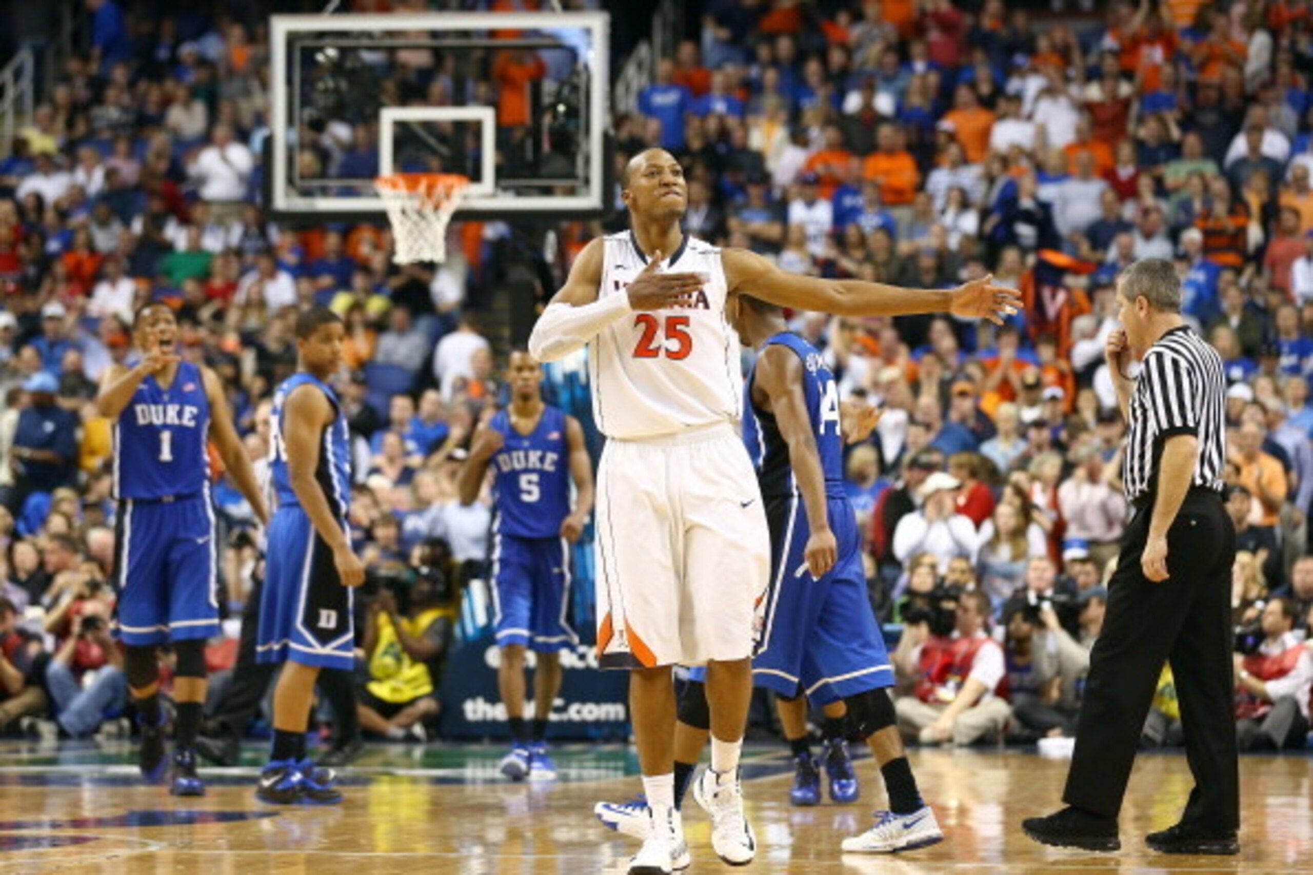 GREENSBORO, NC - MARCH 16:  Akil Mitchell #25 of the Virginia Cavaliers reacts during the final minutes of their victory over the Duke Blue Devils in the finals of the 2014 Men's ACC Basketball Tournament at Greensboro Coliseum on March 16, 2014 in Greens