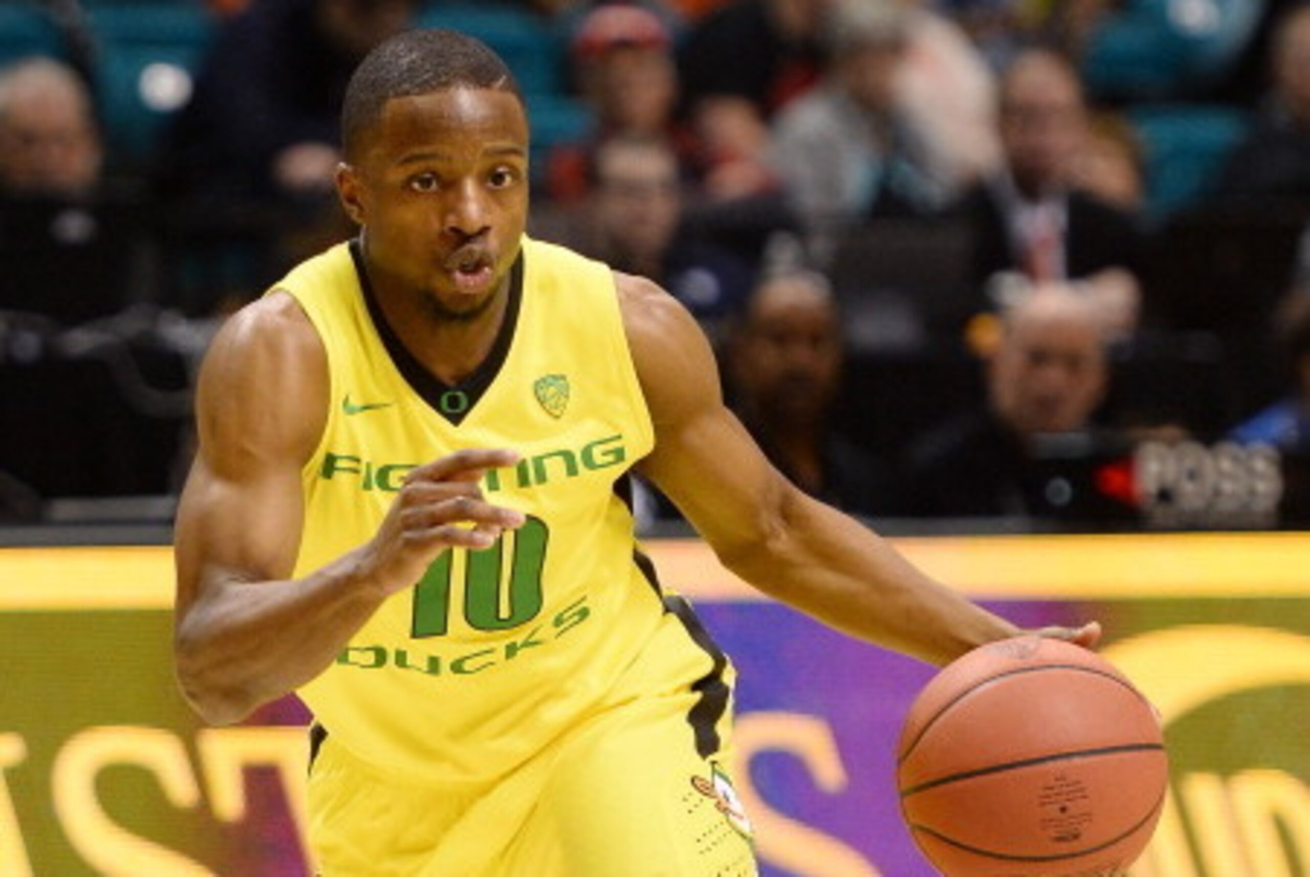 LAS VEGAS, NV - MARCH 12:  Johnathan Loyd #10 of the Oregon Ducks brings the ball up the court against the Oregon State Beavers during a first-round game of the Pac-12 Basketball Tournament at the MGM Grand Garden Arena on March 12, 2014 in Las Vegas, Nev