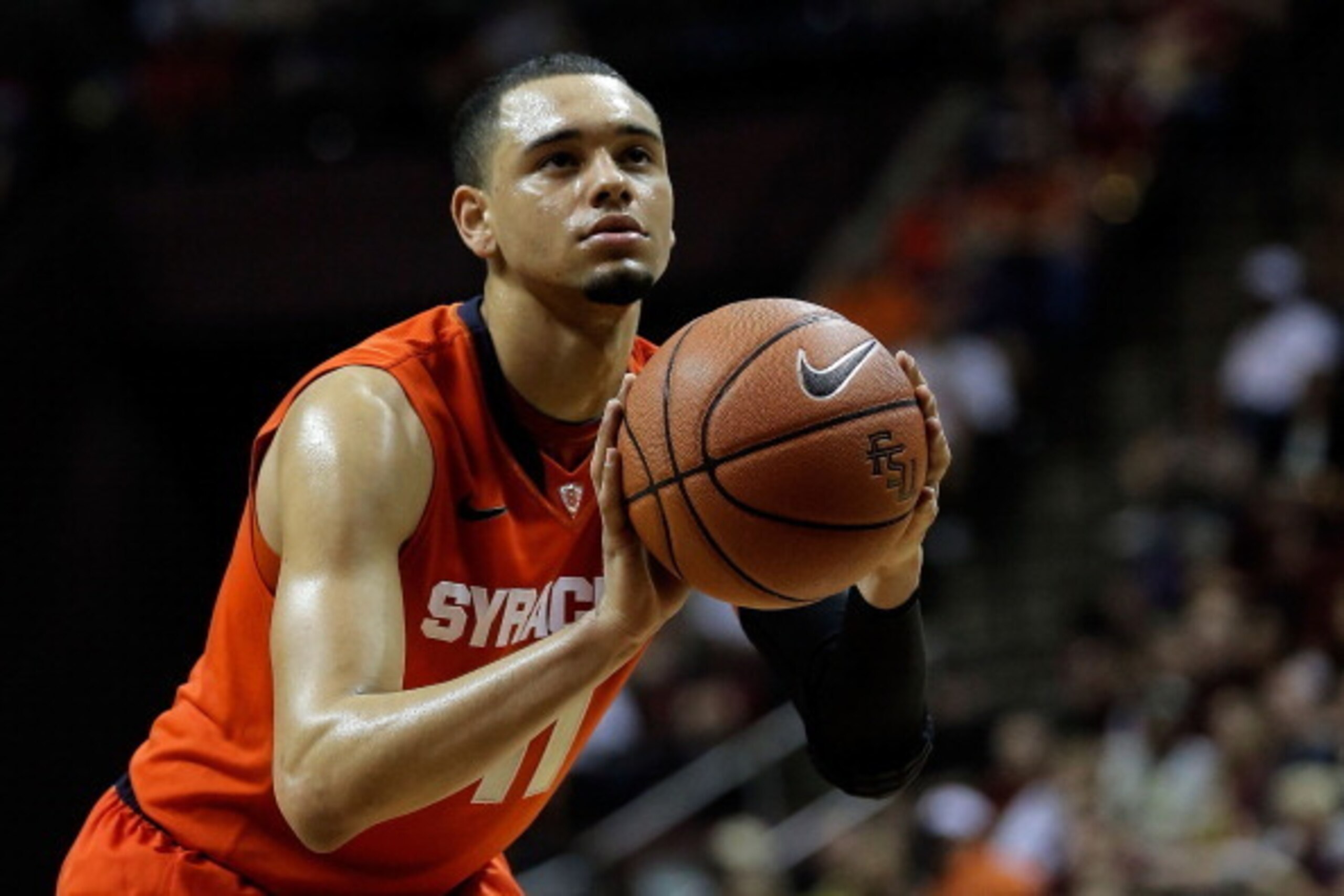 TALLAHASSEE, FL - MARCH 09:  Tyler Ennis #11 of the Syracuse Orangemen shoots a free throw against the Florida State Seminoles during a game at the Donald L. Tucker Center on March 9, 2014 in Tallahassee, Florida.  Syracuse won the game 74-58.  (Photo by 