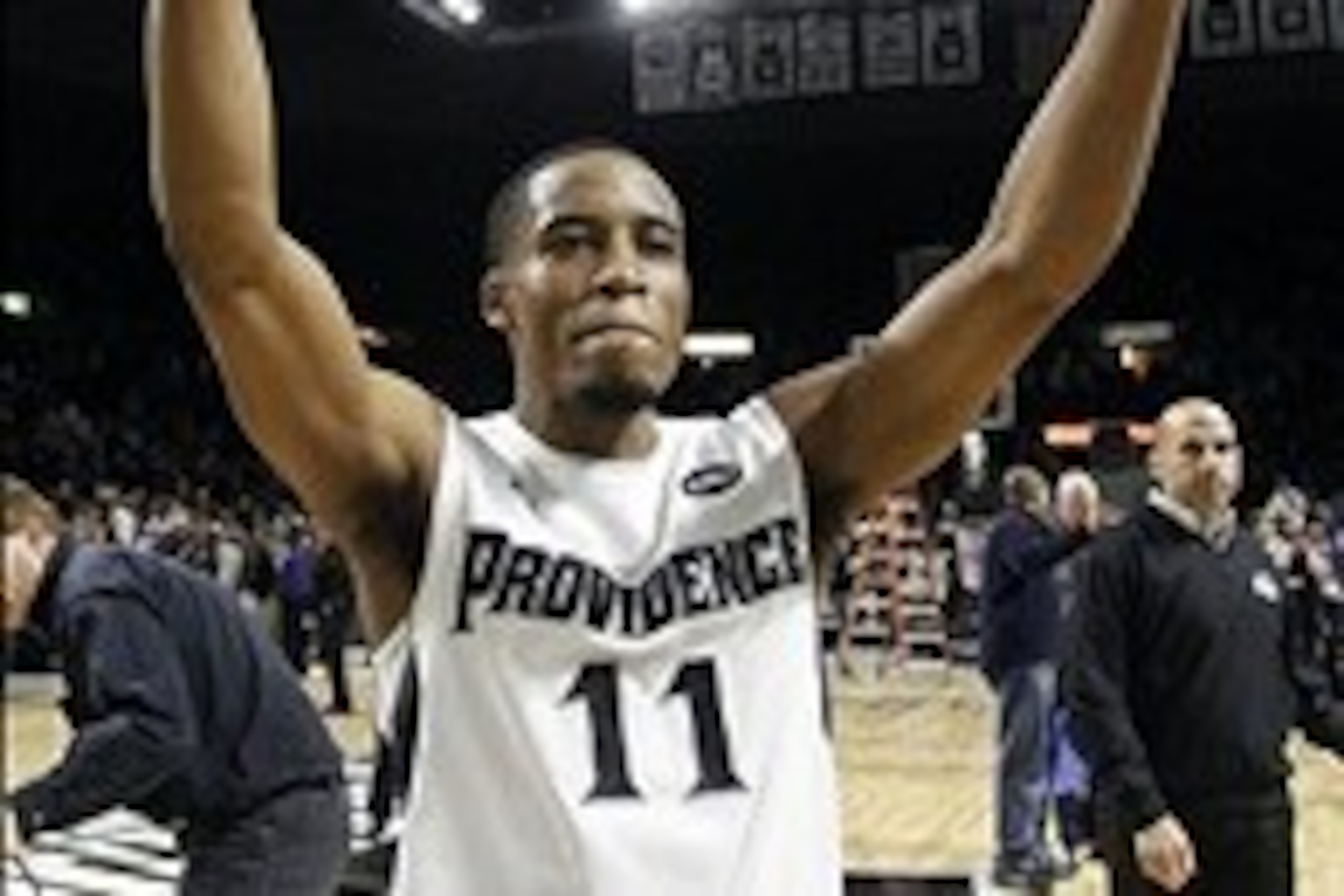 Mar 4, 2014; Providence, RI, USA; Providence Friars guard Bryce Cotton (11) celebrates after making two free throws in the final second to defeat the Marquette Golden Eagles 81-80 in double overtime at the Dunkin' Donuts Center. Mandatory Credit: Stew Mil