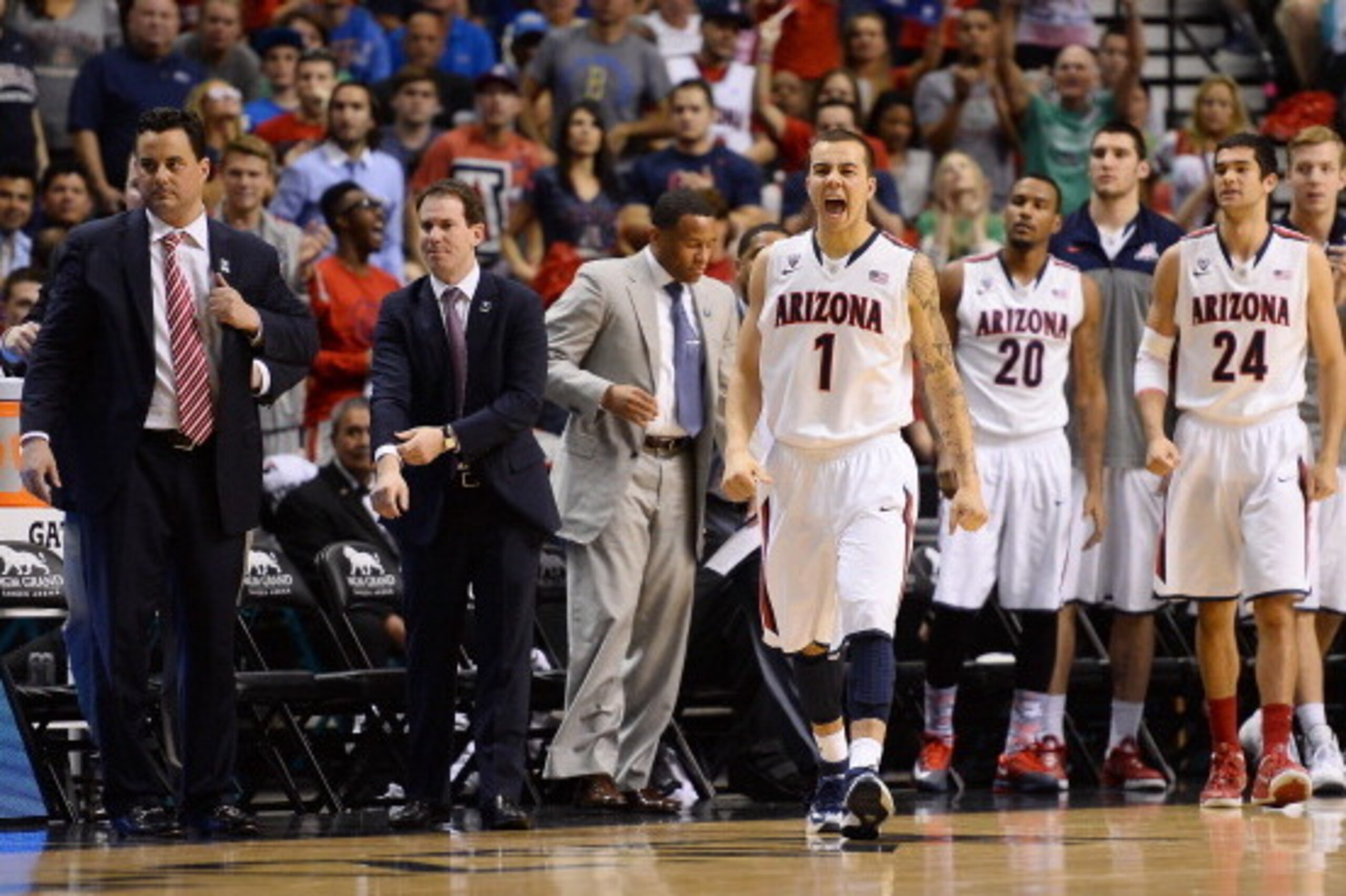 LAS VEGAS, NV - MARCH 15:  Gabe York #1 of the Arizona Wildcats reacts as head coach Sean Miller (L) and teammates Jordin Mayes #20 and Elliott Pitts #24 look on during a timeout in the championship game of the Pac-12 Basketball Tournament against the UCL