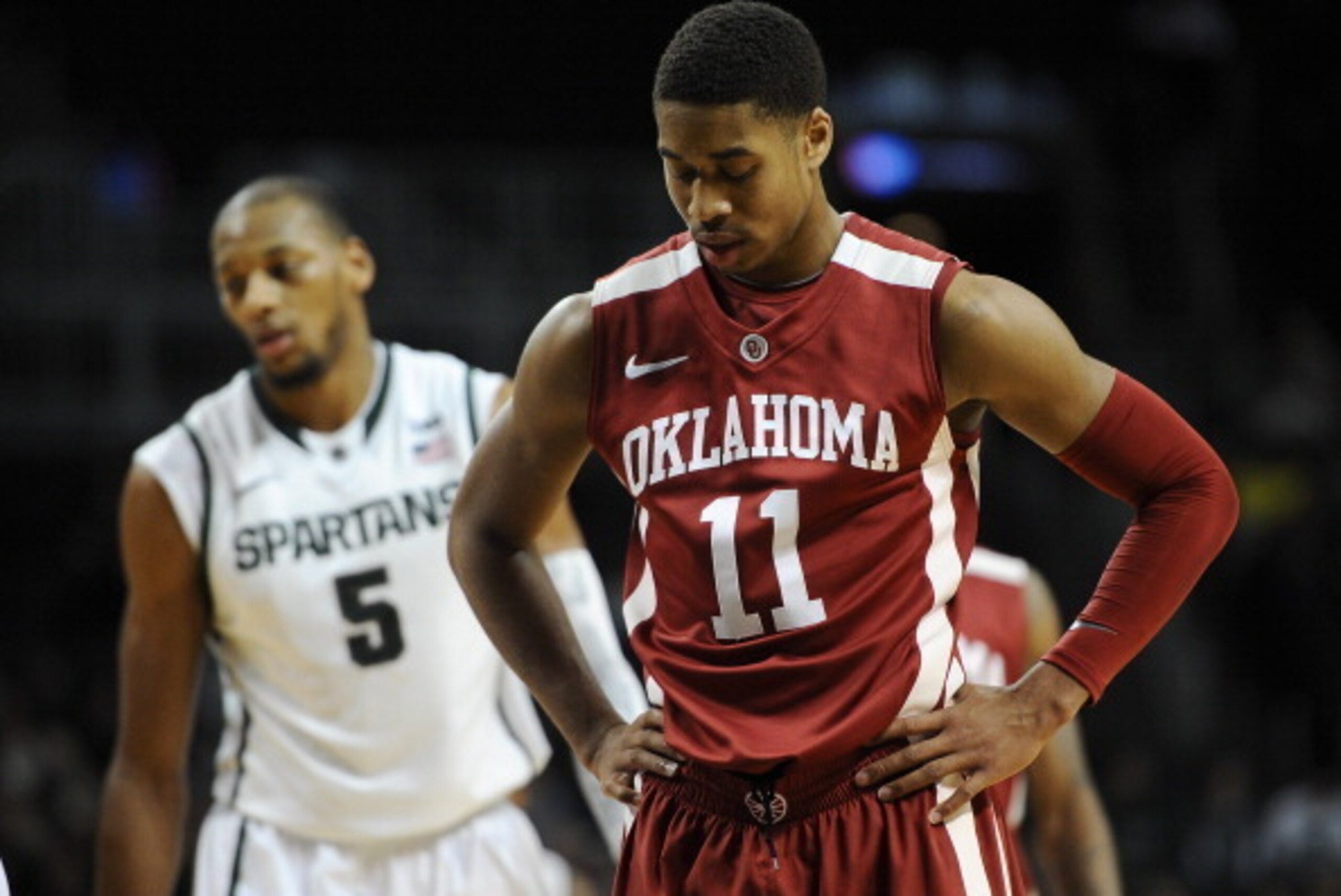 NEW YORK, NY - NOVEMBER 23:  Isaiah Cousins #11 of the Oklahoma Sooners looks on during the second half against the Michigan State Spartans at Barclays Center on November 23, 2013 in the Brooklyn borough of New York City. The Spartans defeat the Sooners 8