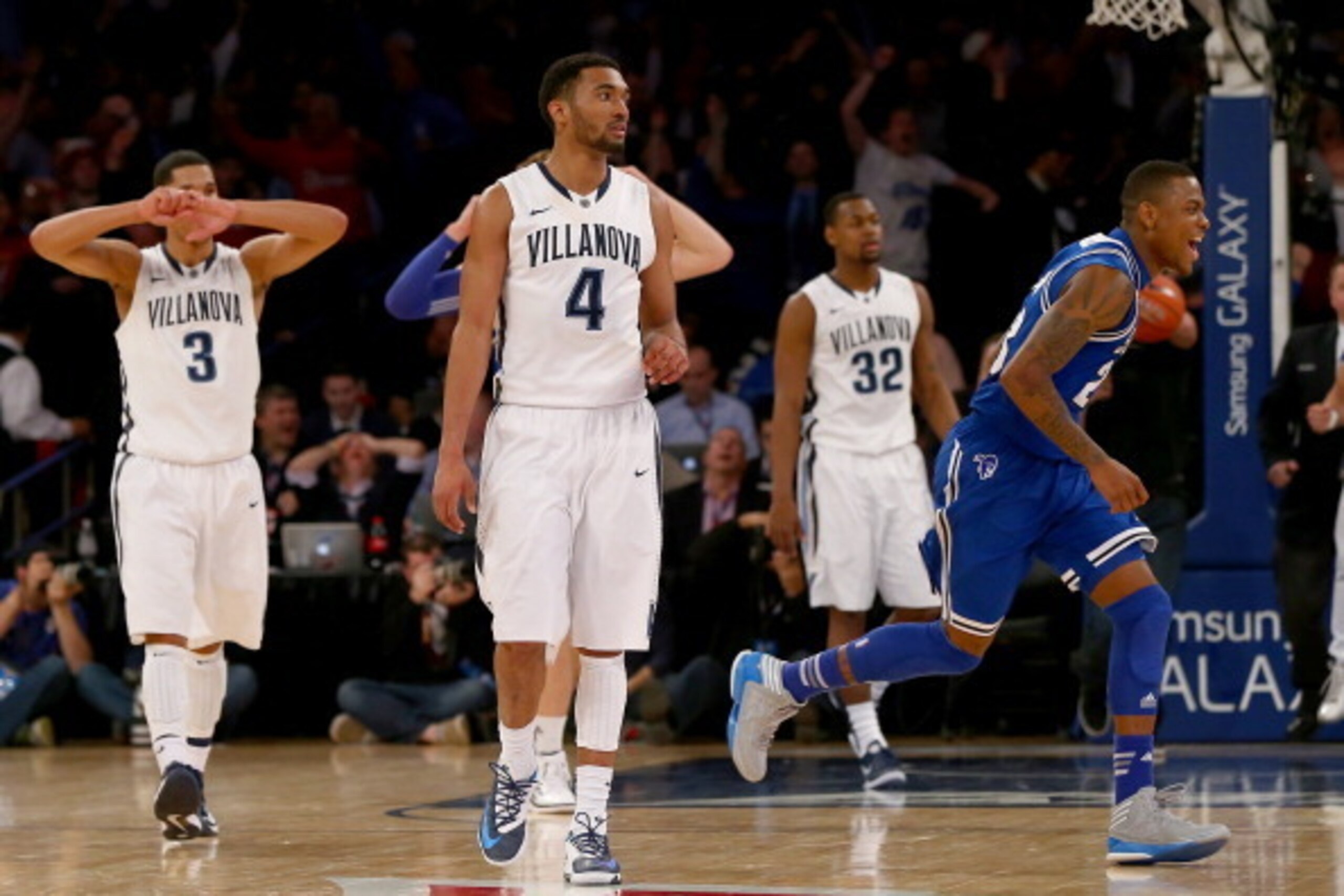 NEW YORK, NY - MARCH 13:  Fuquan Edwin #23 of the Seton Hall Pirates celebrates the win as Josh Hart #3,Darrun Hilliard II #4 and James Bell #32 of the Villanova Wildcats react to the loss during the quarterfinals of the Big East Basketball Tournament at 
