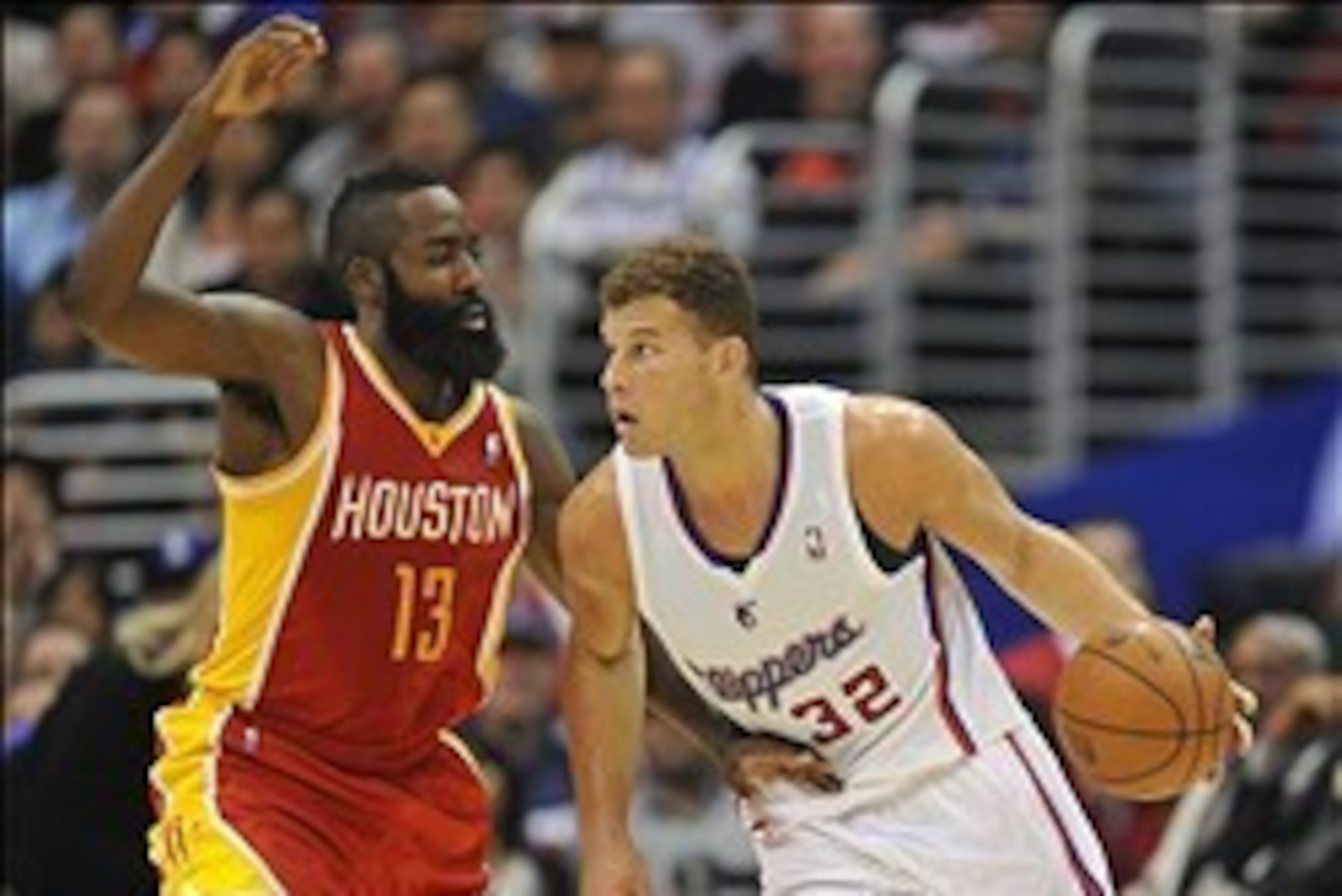 November 4, 2013; Los Angeles, CA, USA; Los Angeles Clippers power forward Blake Griffin (32) moves the ball against the defense of Houston Rockets shooting guard James Harden (13) during the first half at Staples Center. Mandatory Credit: Gary A. Vasquez