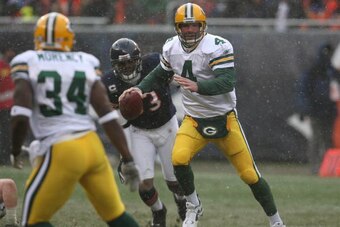 CHICAGO - DECEMBER 23: Brett Favre #4 of the Green Bay Packers looks for an open receiver during the game against the Chicago Bears on December 23, 2007 at Soldier Field in Chicago, Illinois. The Bears defeated the Packers 35-7. (Photo by Jonathan Daniel/