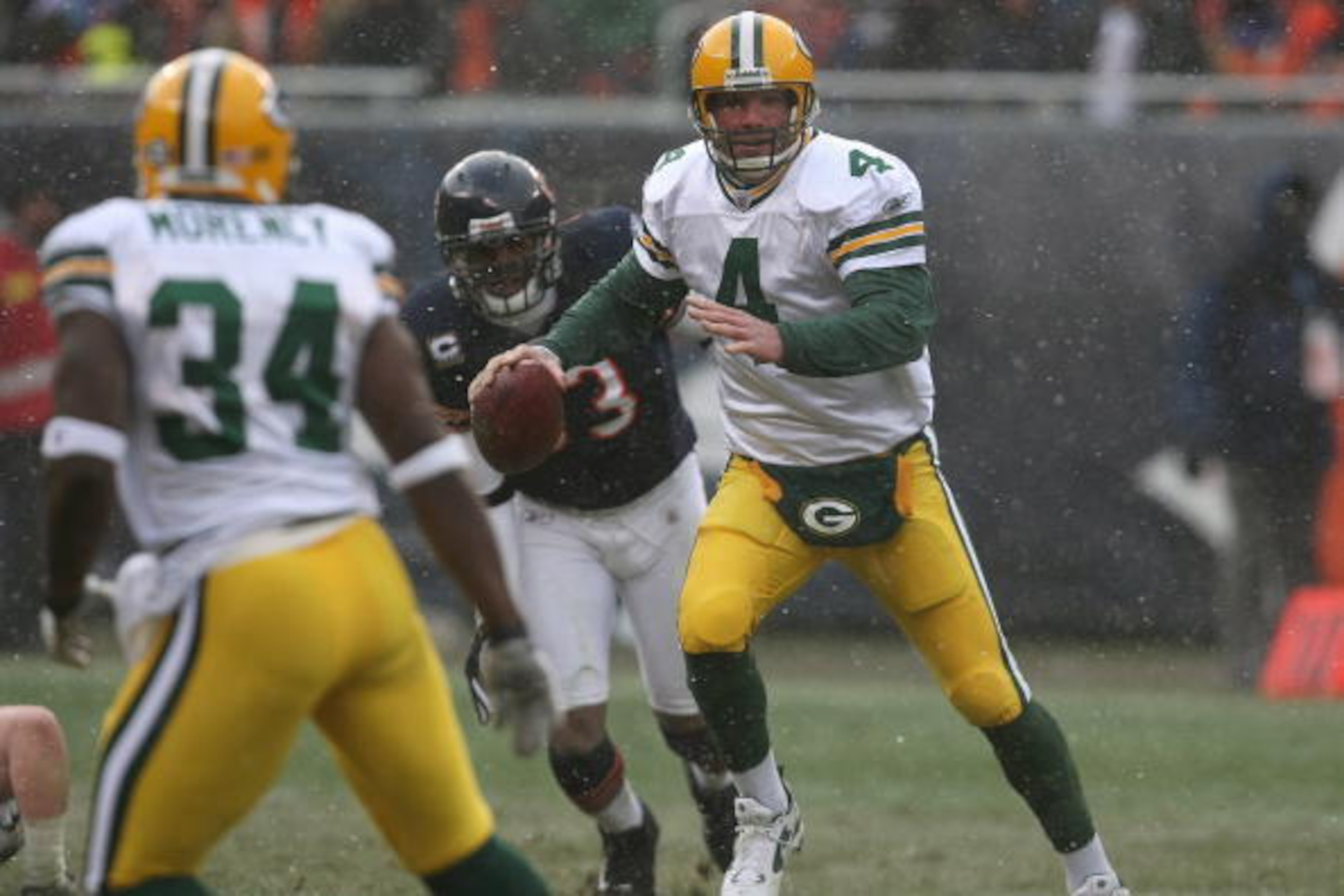 CHICAGO - DECEMBER 23: Brett Favre #4 of the Green Bay Packers looks for an open receiver during the game against the Chicago Bears on December 23, 2007 at Soldier Field in Chicago, Illinois. The Bears defeated the Packers 35-7. (Photo by Jonathan Daniel/ CHICAGO - DECEMBER 23: Brett Favre #4 of the Green Bay Packers looks for an open receiver during the game against the Chicago Bears on December 23, 2007 at Soldier Field in Chicago, Illinois. The Bears defeated the Packers 35-7. (Photo by Jonathan Daniel/