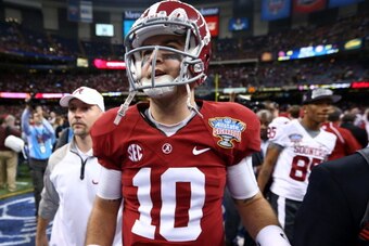 NEW ORLEANS, LA - JANUARY 02:  AJ McCarron #10 of the Alabama Crimson Tide walks off the field after the Allstate Sugar Bowl at the Mercedes-Benz Superdome on January 2, 2014 in New Orleans, Louisiana.  The Sooners defeated the Crimson Tide 45-31.  (Photo