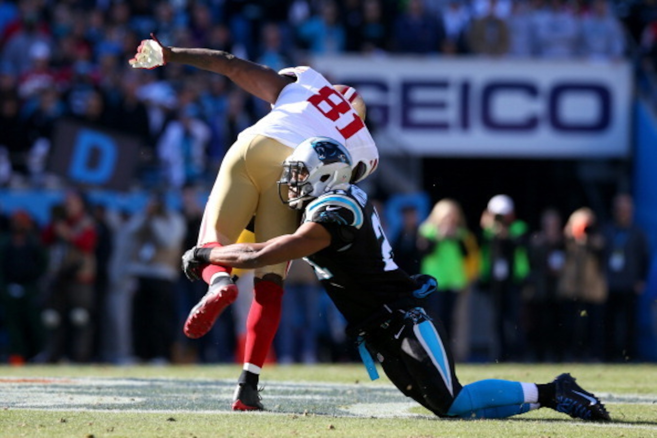CHARLOTTE, NC - JANUARY 12: Anquan Boldin #81 of the San Francisco 49ers is tackled by Mike Mitchell #21 of the Carolina Panthers in the second quarter during the NFC Divisional Playoff Game at Bank of America Stadium on January 12, 2014 in Charlotte, Nor