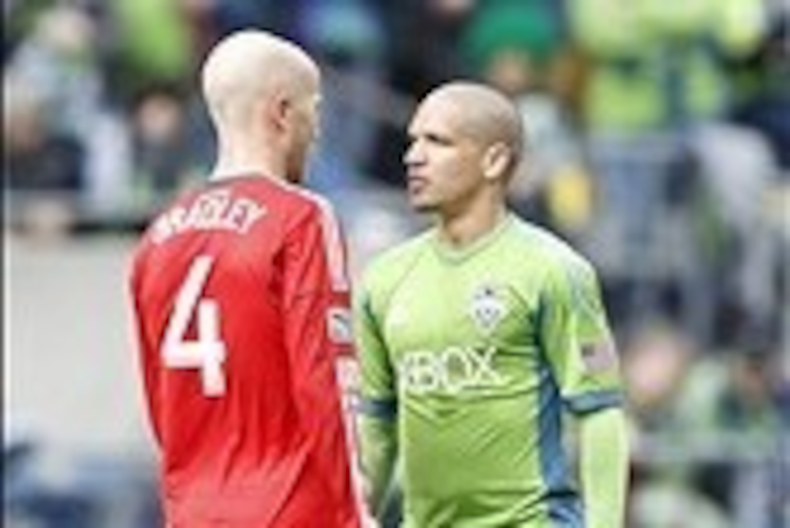 Mar 15, 2014; Seattle, WA, USA; Seattle Sounders FC midfielder Osvaldo Alonso (6) speaks with Toronto FC midfielder Michael Bradley (4) following a foul during the second half at CenturyLink Field. Mandatory Credit: Joe Nicholson-USA TODAY Sports