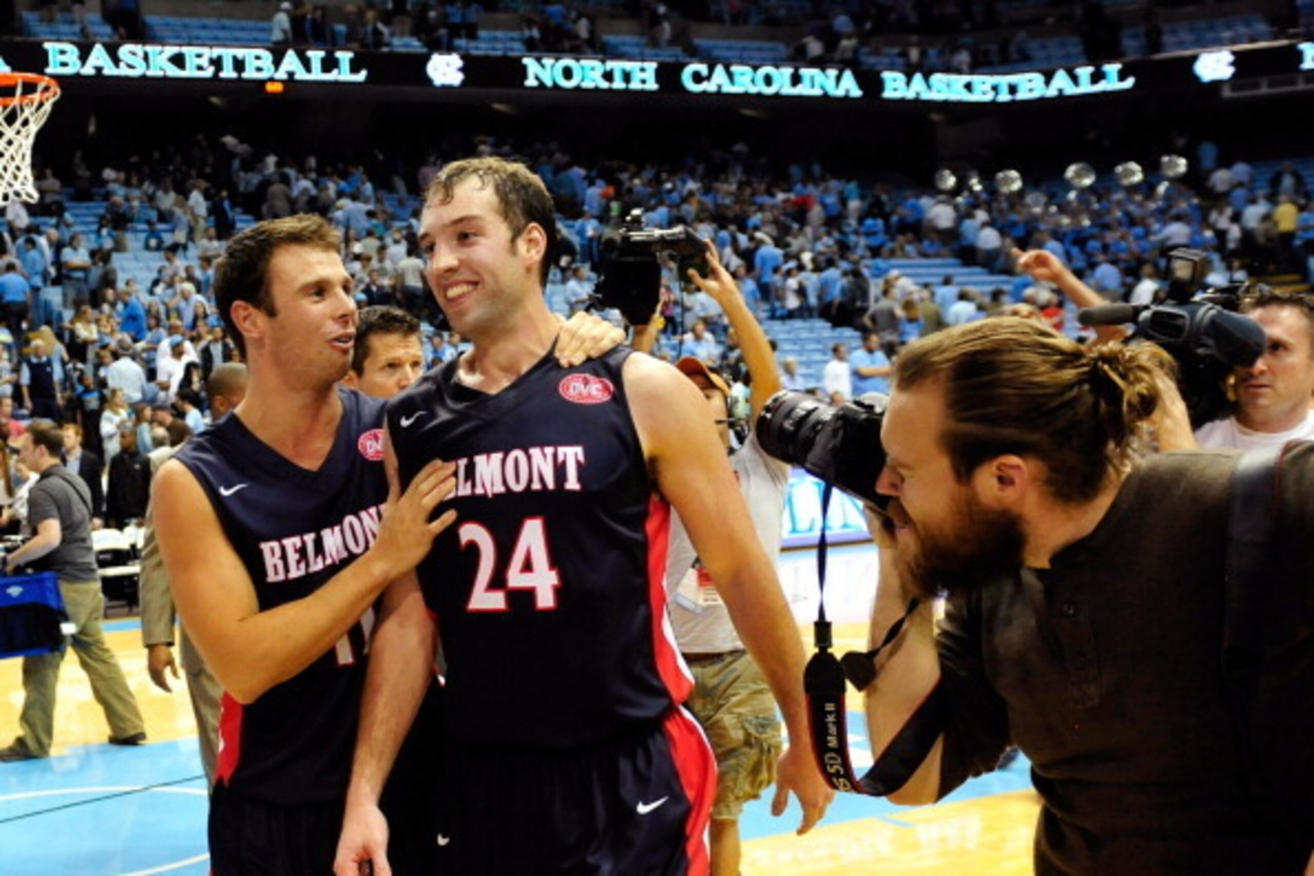 CHAPEL HILL, NC - NOVEMBER 17:  Spencer Turner #11 and J.J. Mann #24 of the Belmont Bruins leave the court after a last-second win over the North Carolina Tar Heels at the Dean Smith Center on November 17, 2013 in Chapel Hill, North Carolina. Mann hit the