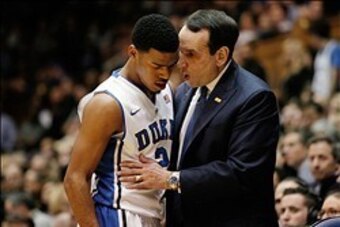 Feb 4, 2014; Durham, NC, USA; Duke Blue Devils head coach Mike Krzyzewski talks to guard Quinn Cook (2) as he heads to the bench in their game against the Wake Forest Demon Deaconsat Cameron Indoor Stadium. Mandatory Credit: Mark Dolejs-USA TODAY Sports