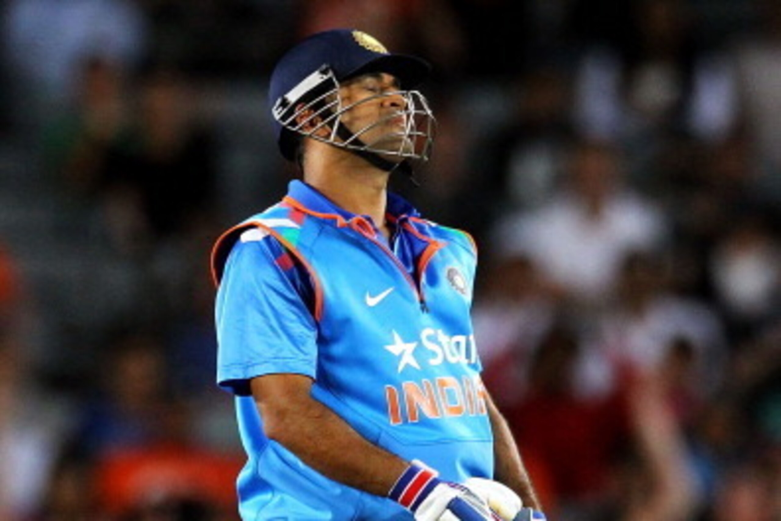 AUCKLAND, NEW ZEALAND - JANUARY 25: MS Dhoni of India reacts after he is dsimissed by Tim Southee of New Zealand during the One Day International match between New Zealand and India at Eden Park on January 25, 2014 in Auckland, New Zealand.  (Photo by Ant