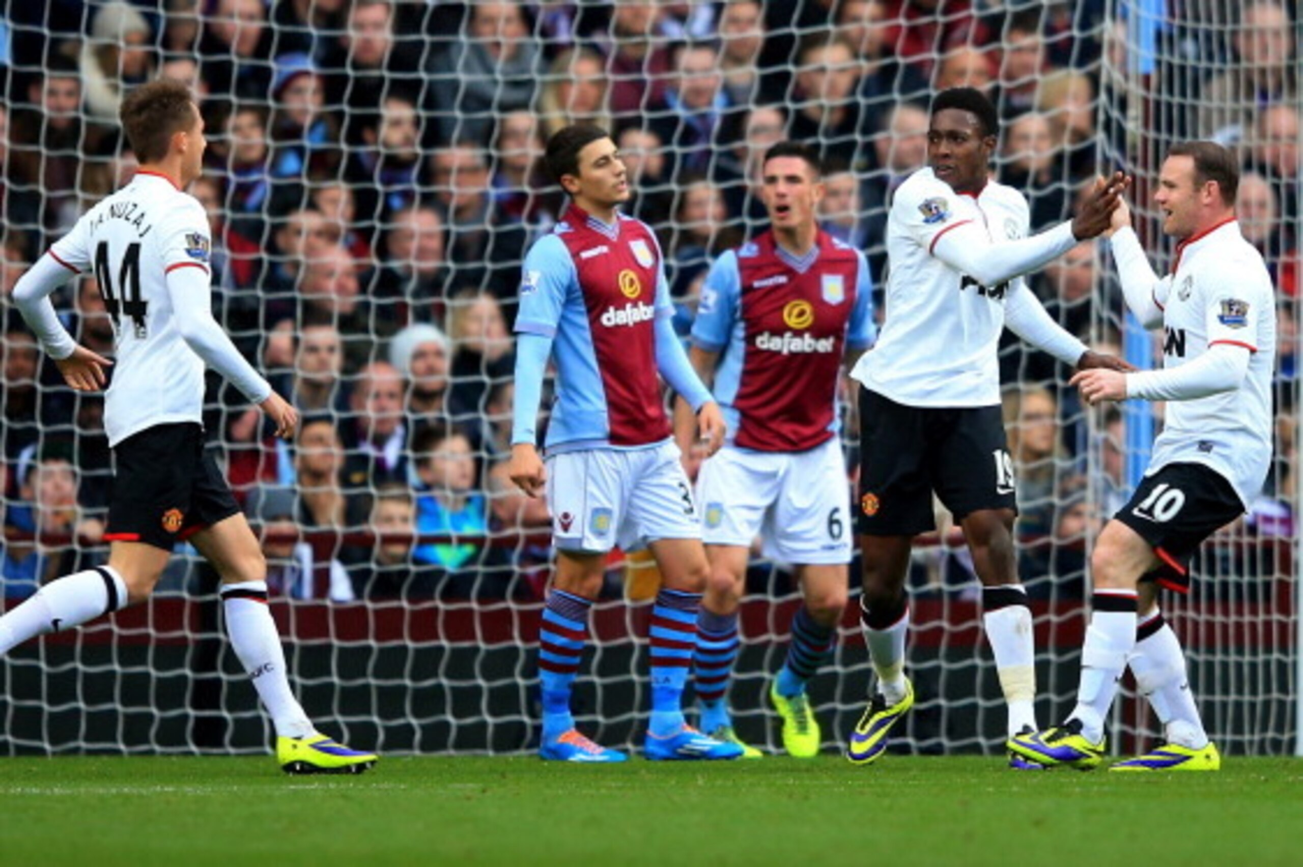 BIRMINGHAM, ENGLAND - DECEMBER 15: Danny Welbeck of Manchester United (19) is by congratulated by Wayne Rooney (10) and Adnan Januzaj (44) as he scores their first goal during the Barclays Premier League match between Aston Villa and Manchester United at BIRMINGHAM, ENGLAND - DECEMBER 15: Danny Welbeck of Manchester United (19) is by congratulated by Wayne Rooney (10) and Adnan Januzaj (44) as he scores their first goal during the Barclays Premier League match between Aston Villa and Manchester United at