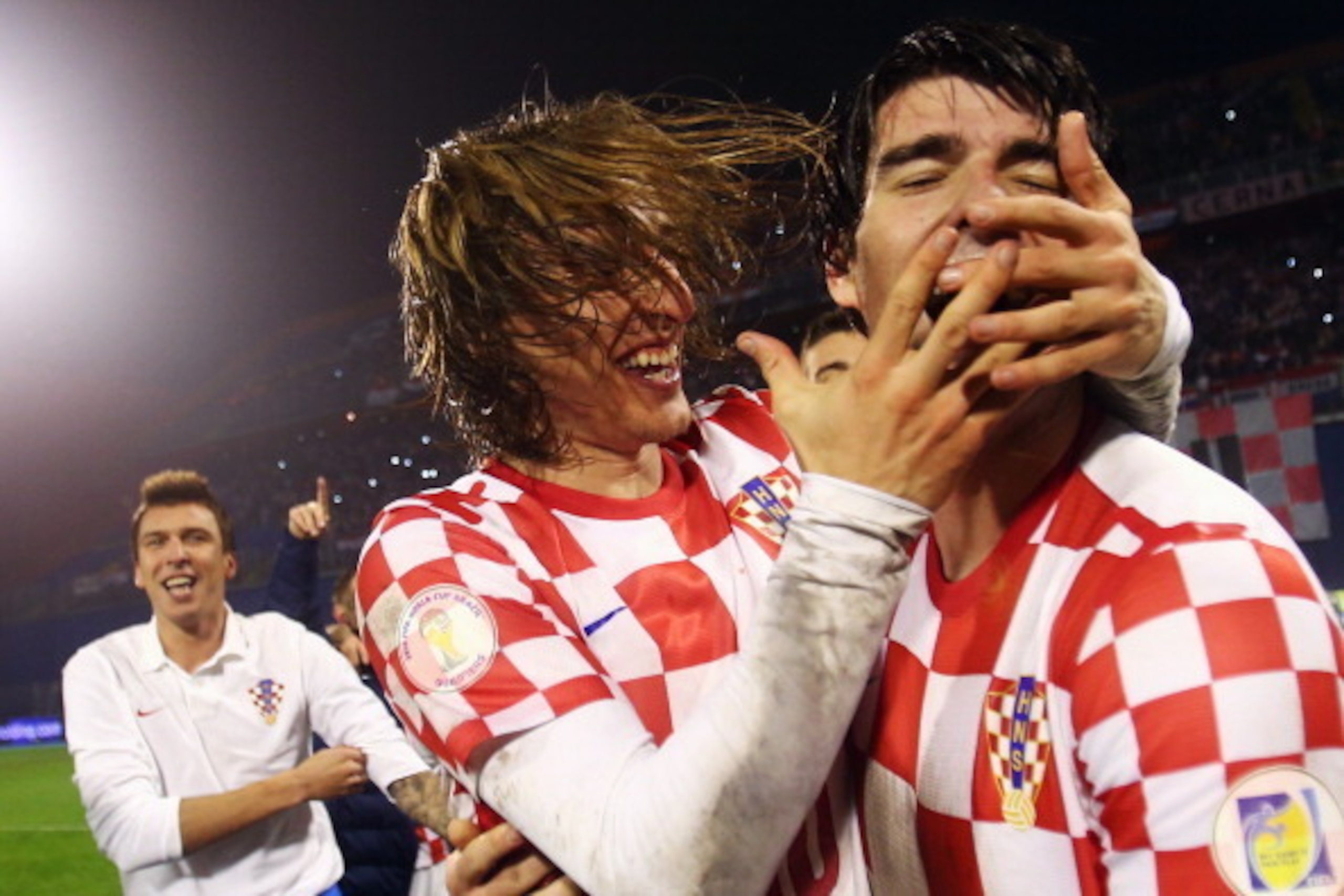 ZAGREB, CROATIA - NOVEMBER 19:  Luka Modric (L) and Vedran Corluka of Croatia celebrate after the FIFA 2014 World Cup Qualifier play-off second leg match between Croatia and Iceland at Maksimir Stadium on November 19, 2013 in Zagreb, Croatia.  (Photo by A