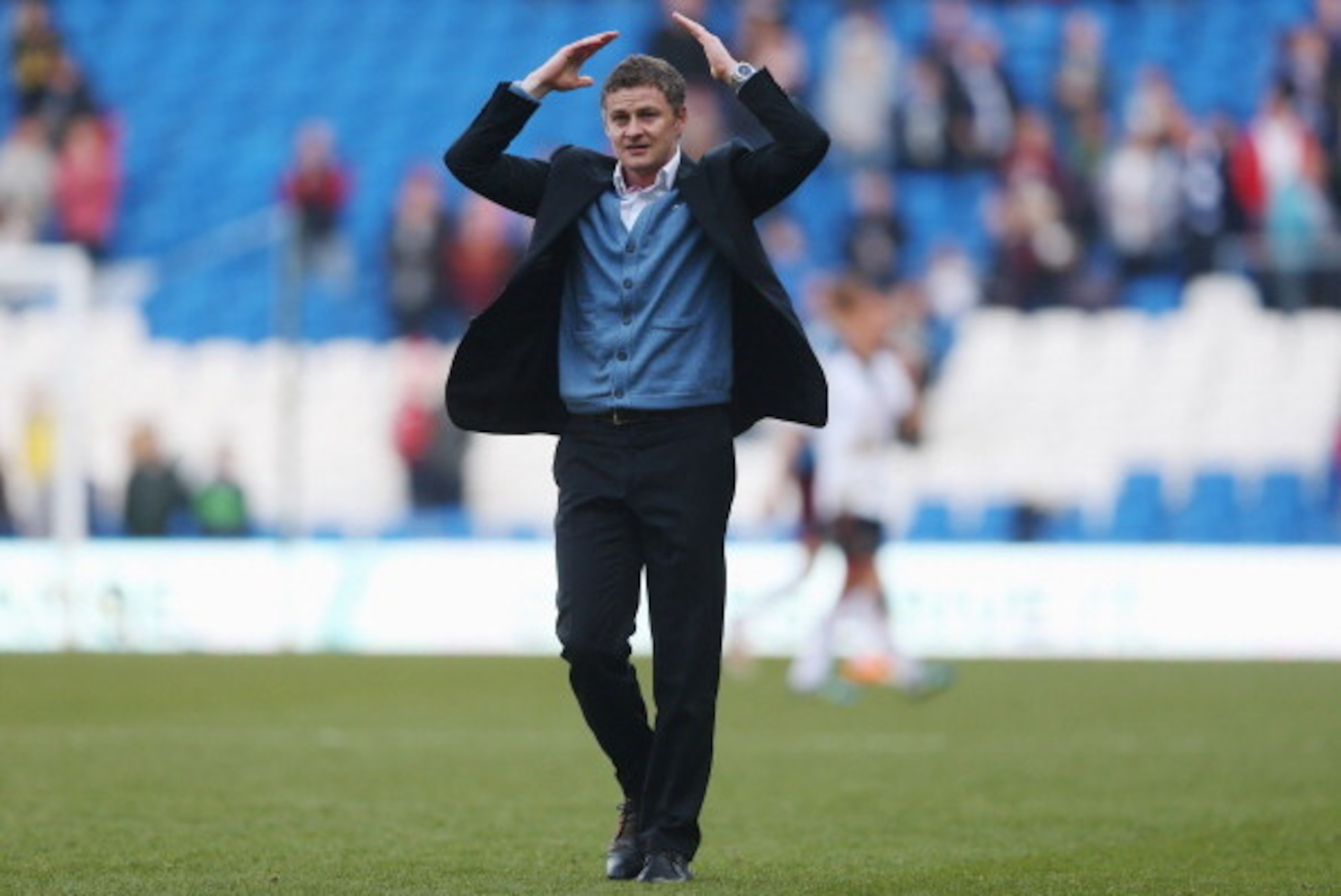 CARDIFF, WALES - MARCH 08:  Ole Gunnar Solskjaer manager of Cardiff City celebrates victory after the Barclays Premier League match between Cardiff City and Fulham at Cardiff City Stadium on March 8, 2014 in Cardiff, Wales.  (Photo by Scott Heavey/Getty I