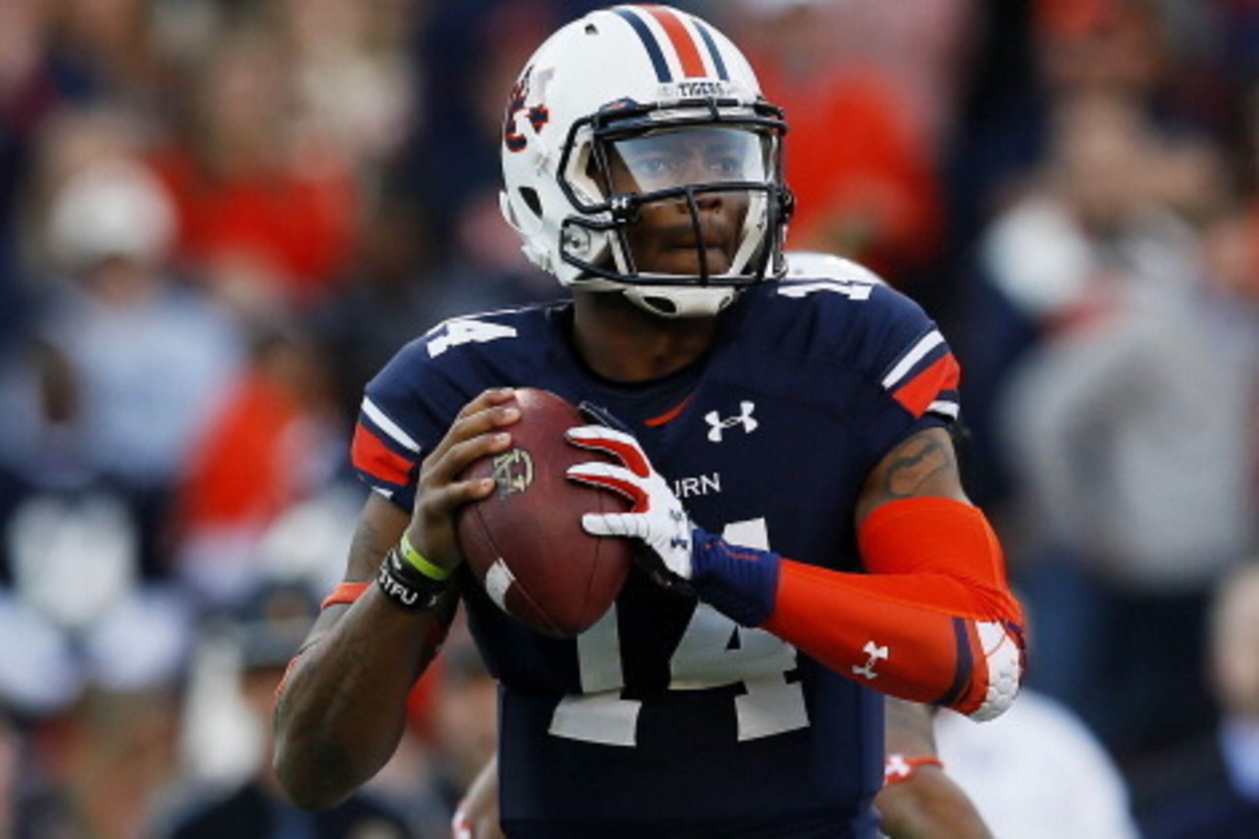 AUBURN, AL - NOVEMBER 30:  Nick Marshall #14 of the Auburn Tigers looks to pass against the Alabama Crimson Tide in the first half at Jordan-Hare Stadium on November 30, 2013 in Auburn, Alabama.  (Photo by Kevin C. Cox/Getty Images)
