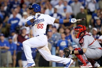 LOS ANGELES, CA - OCTOBER 15:  Yasiel Puig #66 of the Los Angeles Dodgers grounds into a double play in the ninth inning against the St. Louis Cardinals in Game Four of the National League Championship Series at Dodger Stadium on October 15, 2013 in Los A