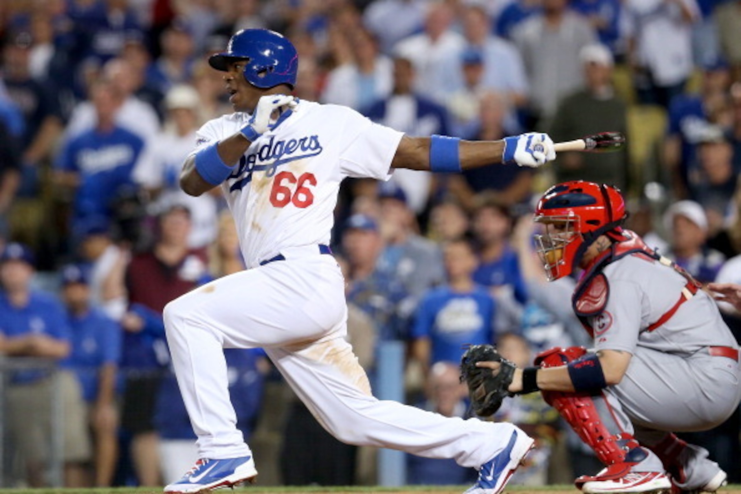 LOS ANGELES, CA - OCTOBER 15:  Yasiel Puig #66 of the Los Angeles Dodgers grounds into a double play in the ninth inning against the St. Louis Cardinals in Game Four of the National League Championship Series at Dodger Stadium on October 15, 2013 in Los A
