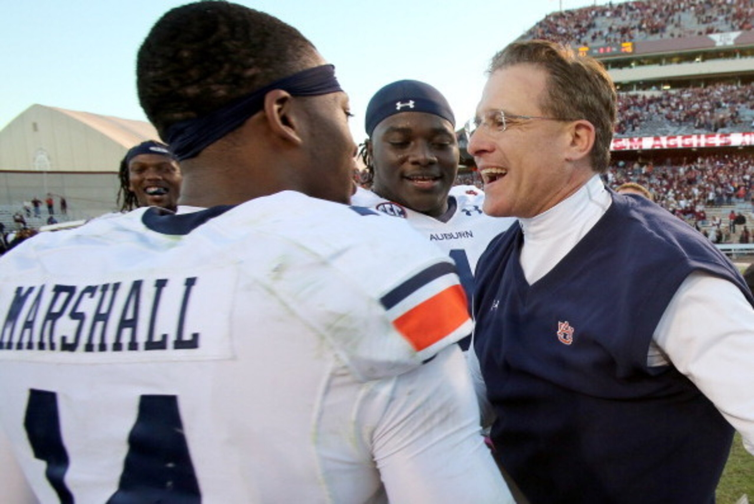 HOUSTON, TX - OCTOBER 19: Nick Marshall #14 of the Auburn Tigers hugs head coach Gus Malzahn of the Auburn Tigers after they defeated the Texas A&M Aggies on October 19, 2013 at Kyle Field in College Station, Texas. Auburn Tigers won 45 to 41.(Photo by Th