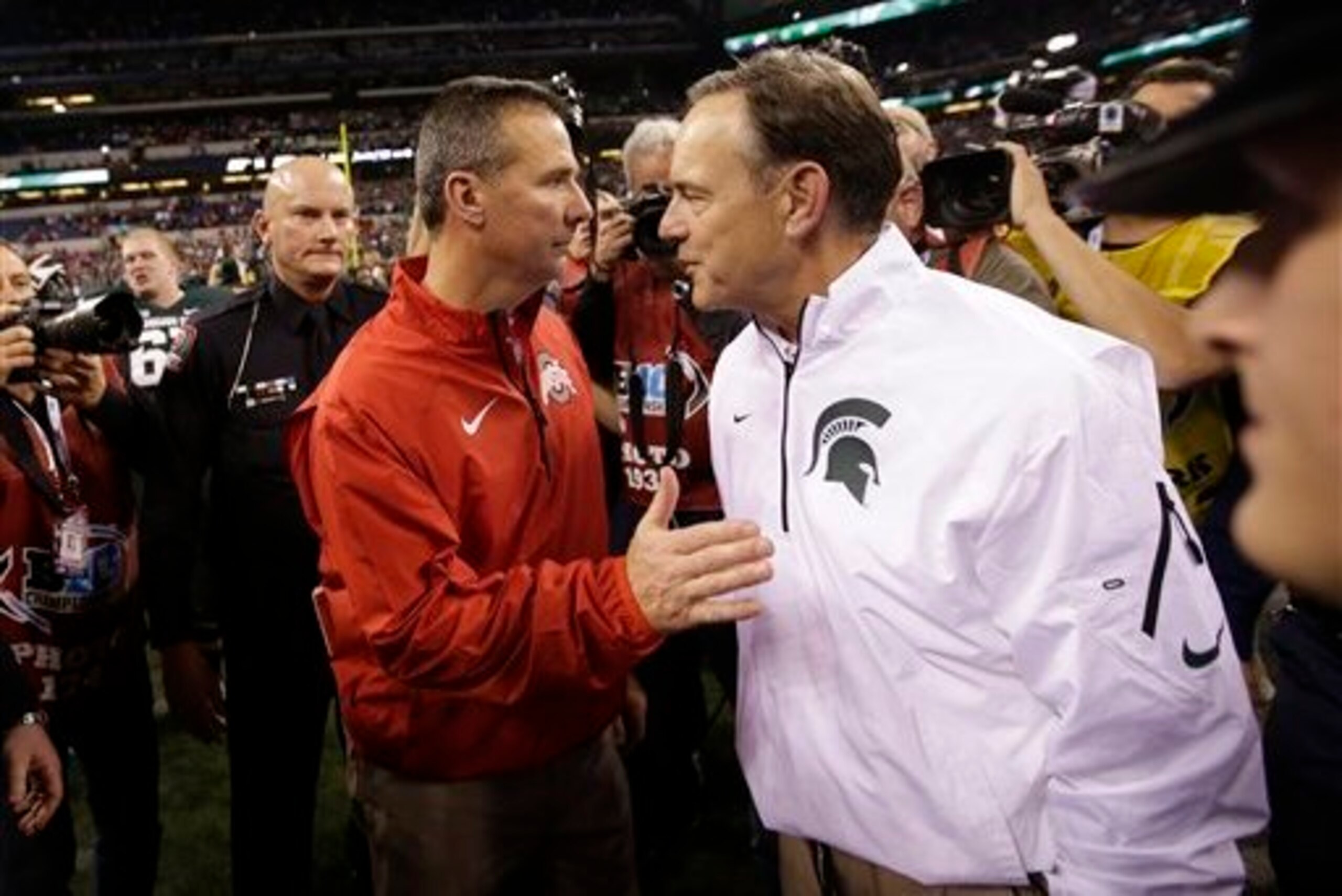 Urban Meyer and Mark Dantonio may go head-to-head for Scott.