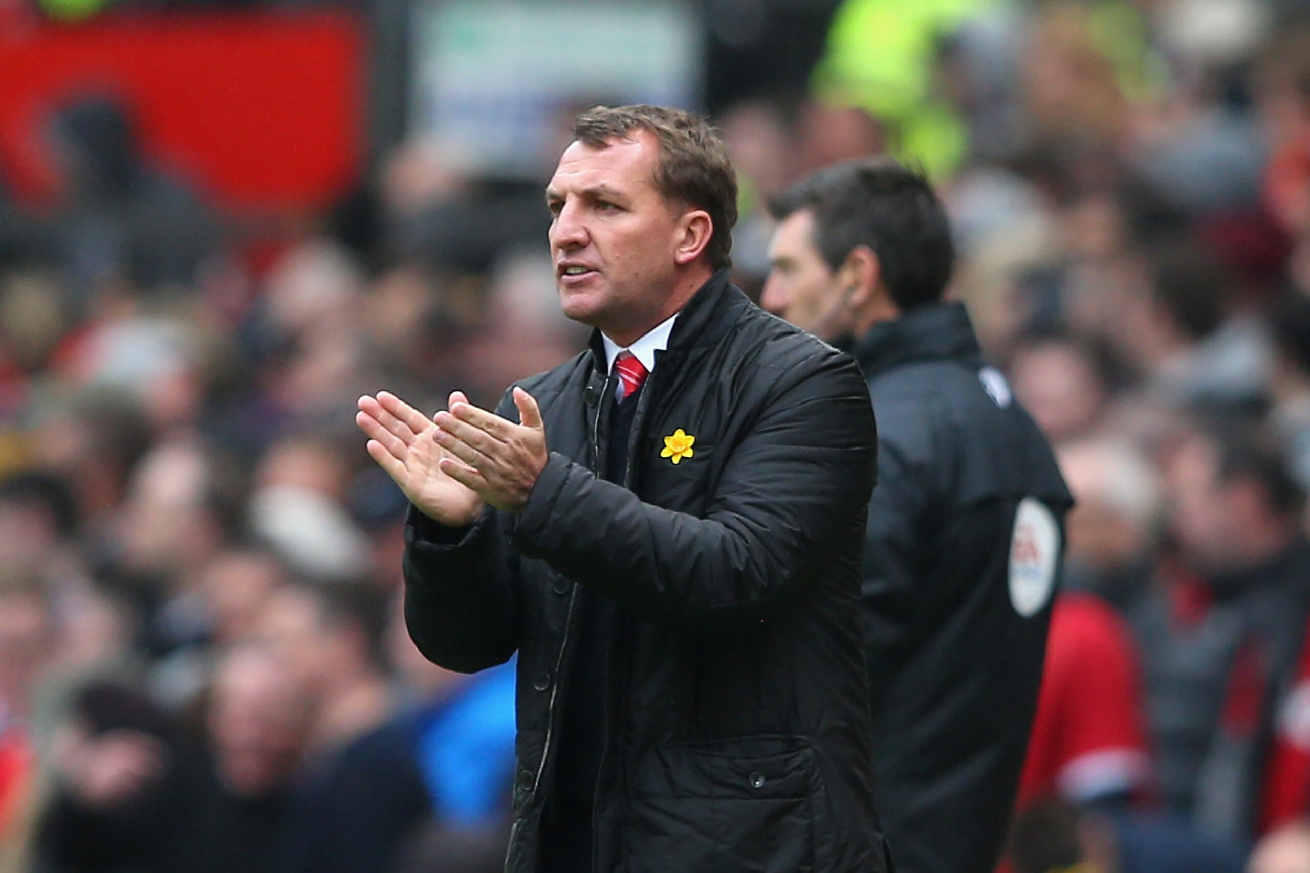 MANCHESTER, ENGLAND - MARCH 16:  Liverpool Manager Brendan Rodgers encourages his players during the Barclays Premier League match between Manchester United and Liverpool at Old Trafford on March 16, 2014 in Manchester, England.  (Photo by Alex Livesey/Ge