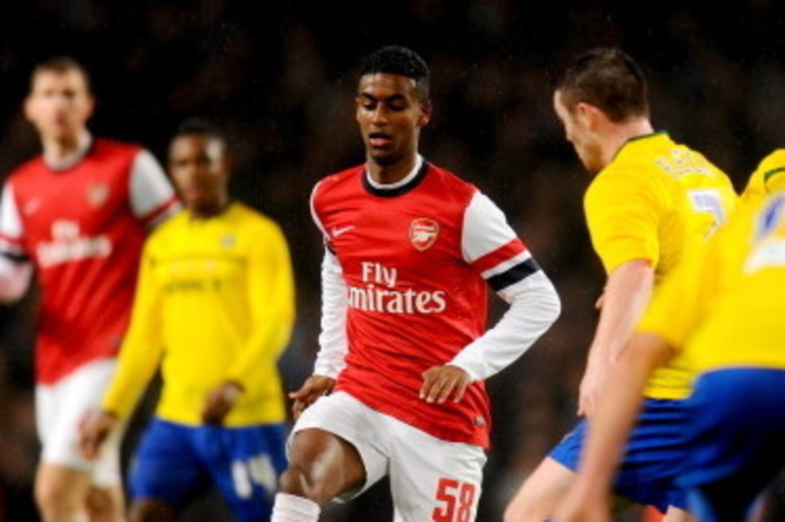 LONDON, ENGLAND - JANUARY 24:  Gedion Zelalem of Arsenal is faced by John Fleck of Coventry City during the FA Cup with Budweiser Fourth round match between Arsenal and Coventry City at Emirates Stadium on January 24, 2014 in London, England.  (Photo by M