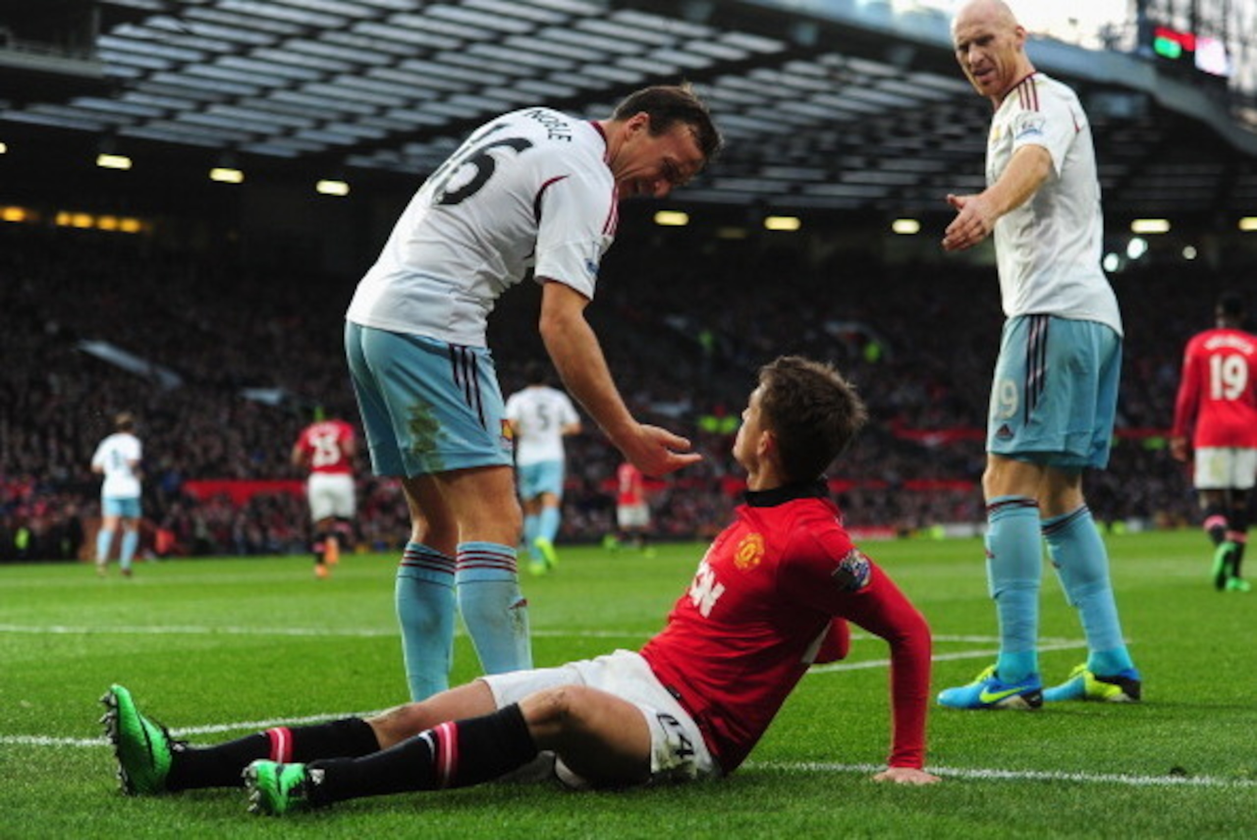 MANCHESTER, ENGLAND - DECEMBER 21:  Adnan Januzaj of Manchester United clashes with Mark Noble and James Collins (R) of West Ham United during the Barclays Premier League match between Manchester United and West Ham United at Old Trafford on December 21, 