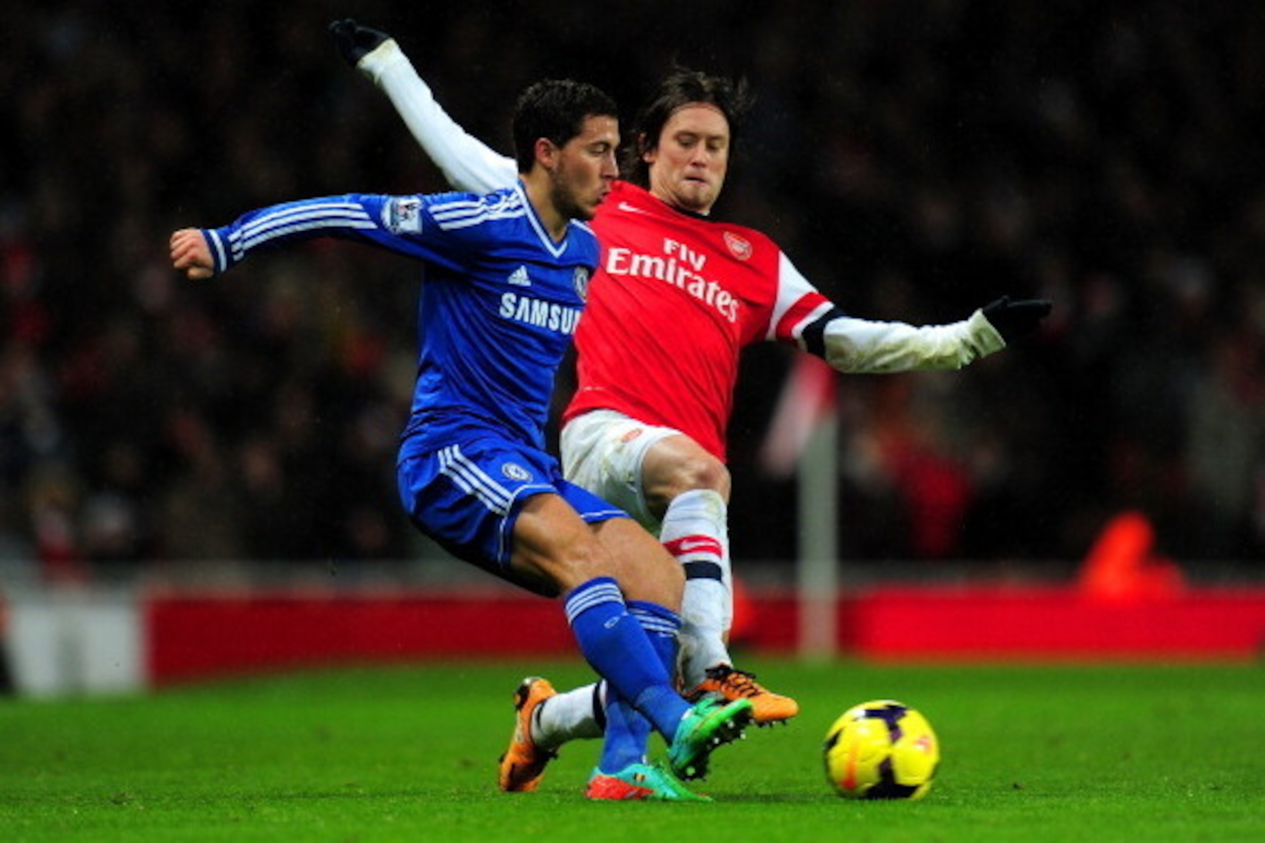 LONDON, ENGLAND - DECEMBER 23:  Tomas Rosicky of Arsenal tackles Eden Hazard of Chelsea during the Barclays Premier League match between Arsenal and Chelsea at Emirates Stadium on December 23, 2013 in London, England.  (Photo by Shaun Botterill/Getty Imag