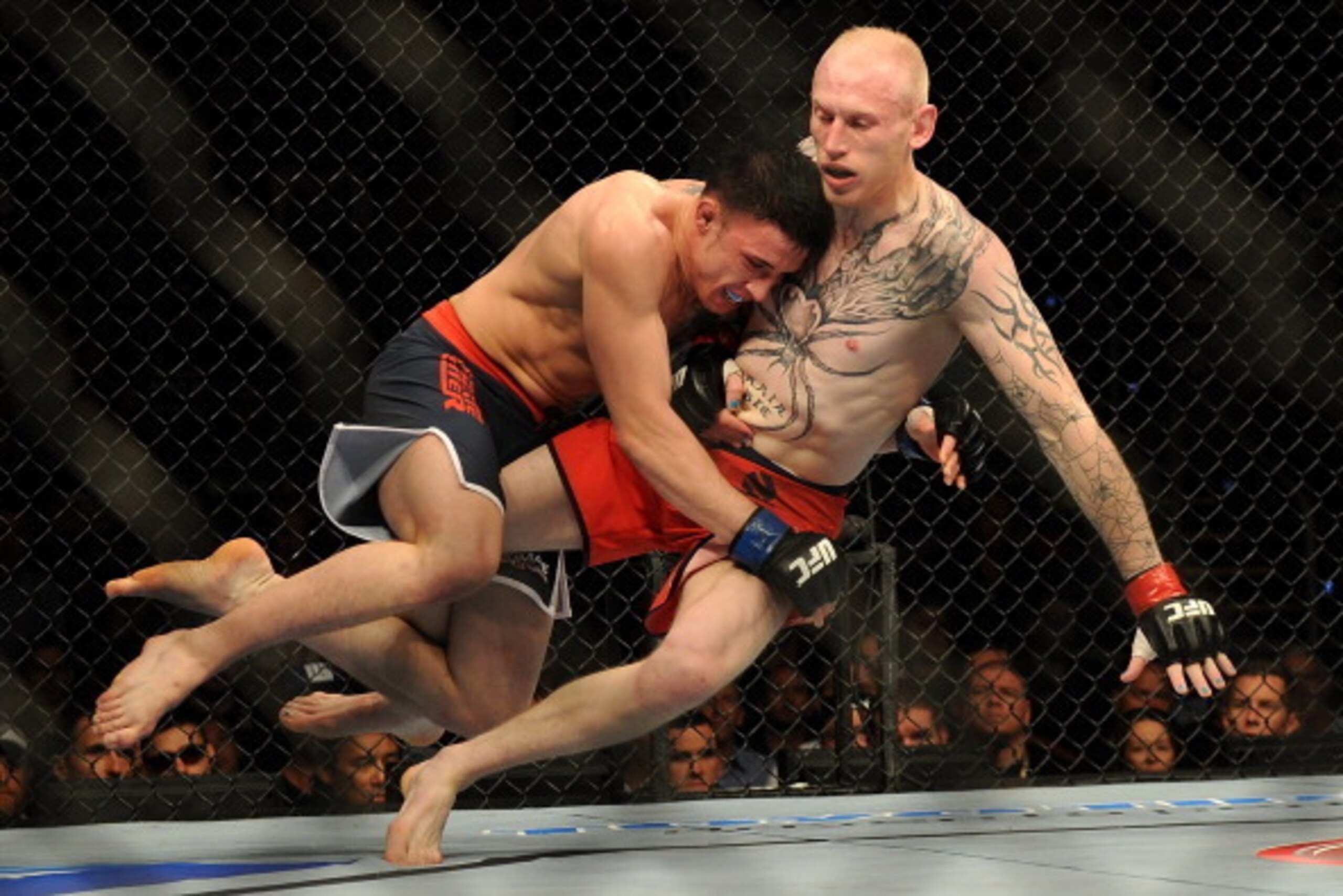 GOLD COAST, AUSTRALIA - DECEMBER 15: Norman Parke (L) lifts Colin Fletcher during the Lightwieght final bout between Colin Fletcher and Norman Parke at Gold Coast Convention and Exhibition Centre on December 15, 2012 on the Gold Coast, Australia. (Photo GOLD COAST, AUSTRALIA - DECEMBER 15: Norman Parke (L) lifts Colin Fletcher during the Lightwieght final bout between Colin Fletcher and Norman Parke at Gold Coast Convention and Exhibition Centre on December 15, 2012 on the Gold Coast, Australia. (Photo