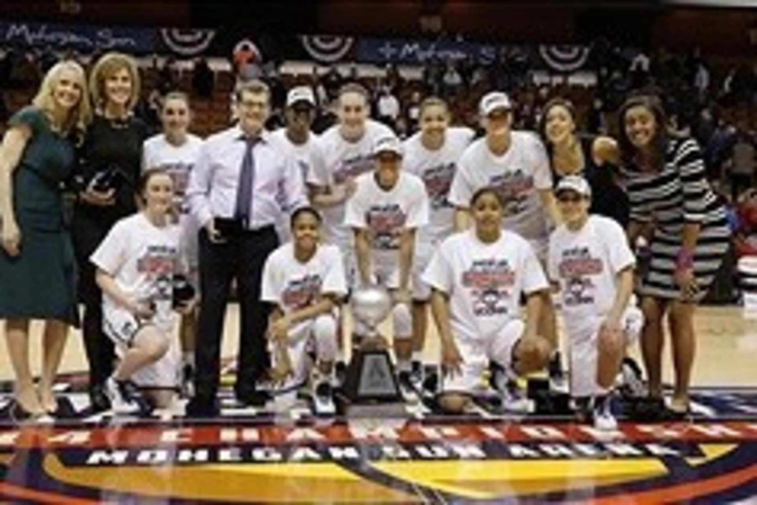 Mar 10, 2014; Uncasville, CT, USA; The Connecticut Huskies pose for pictures after defeating the Louisville Cardinals in the championship game of the American League Athletic Conference Tournament at Mohegan Sun Arena. UConn defeated Louisville 72-52. Man
