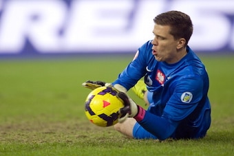 POZNAN, POLAND - NOVEMBER 19: Goalkeeper Wojciech Szczesny of Poland saves during friendly soccer soccer match between Poland and Ireland at the Inea Stadium on November 19, 2013 in Poznan, Poland.  (Photo by Adam Nurkiewicz/Getty Images)