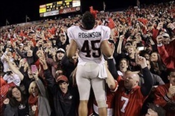 Nov 10, 2012; Auburn, AL, USA: Georgia Bulldogs linebacker Christian Robinson (45) celebrates with fans after the Bulldogs beat the Auburn Tigers 38-0 at Jordan-Hare Stadium.  Mandatory Credit: John Reed-USA TODAY Sports