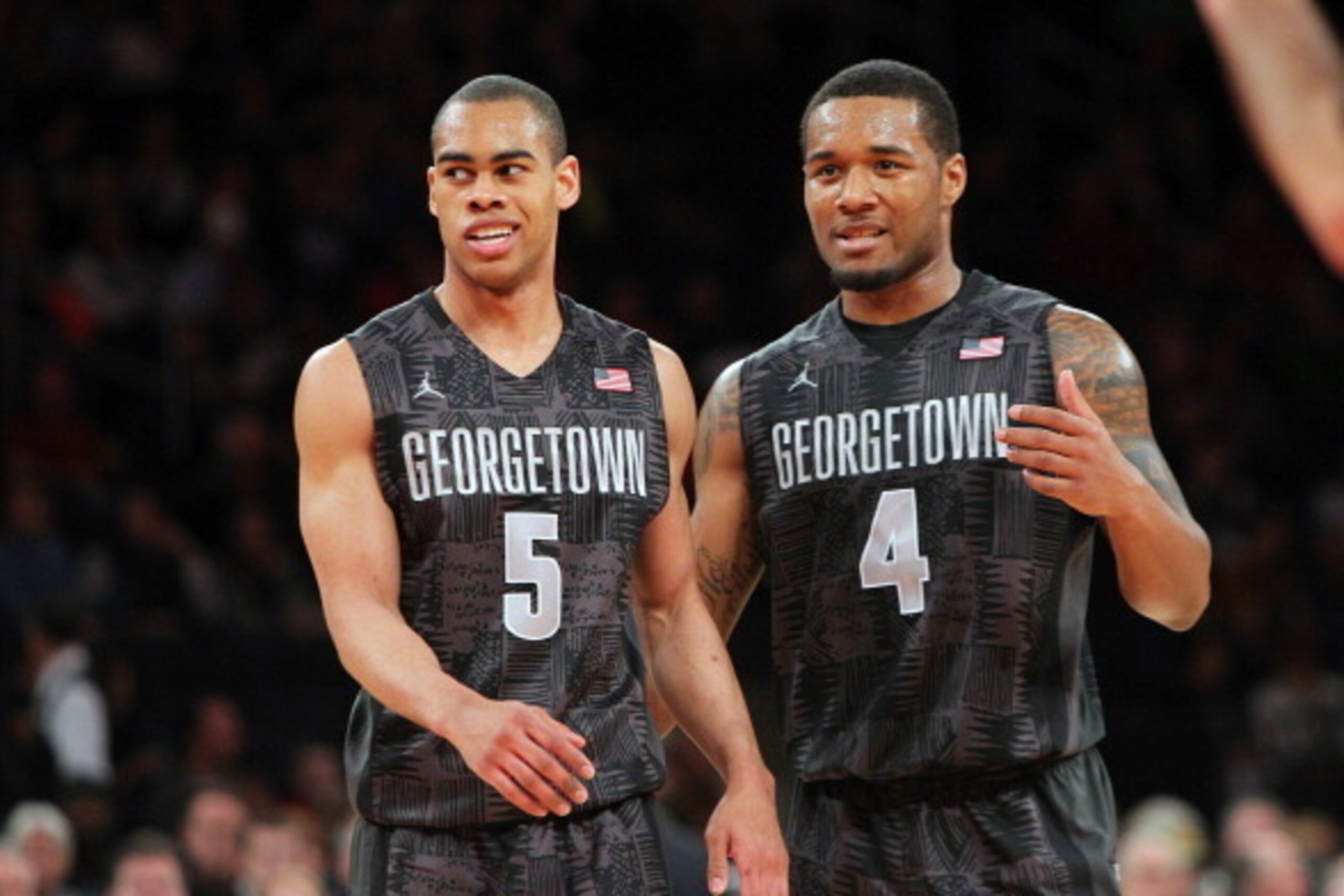 NEW YORK, NY - FEBRUARY 1:  Markel Starks #5 and D'Vauntes Smith-Rivera #4 of the Georgetown Hoyas cheer on the court during their win over the Michigan State Spartans during the game at Madison Square Garden on February 1, 2014 in New York City. (Photo b