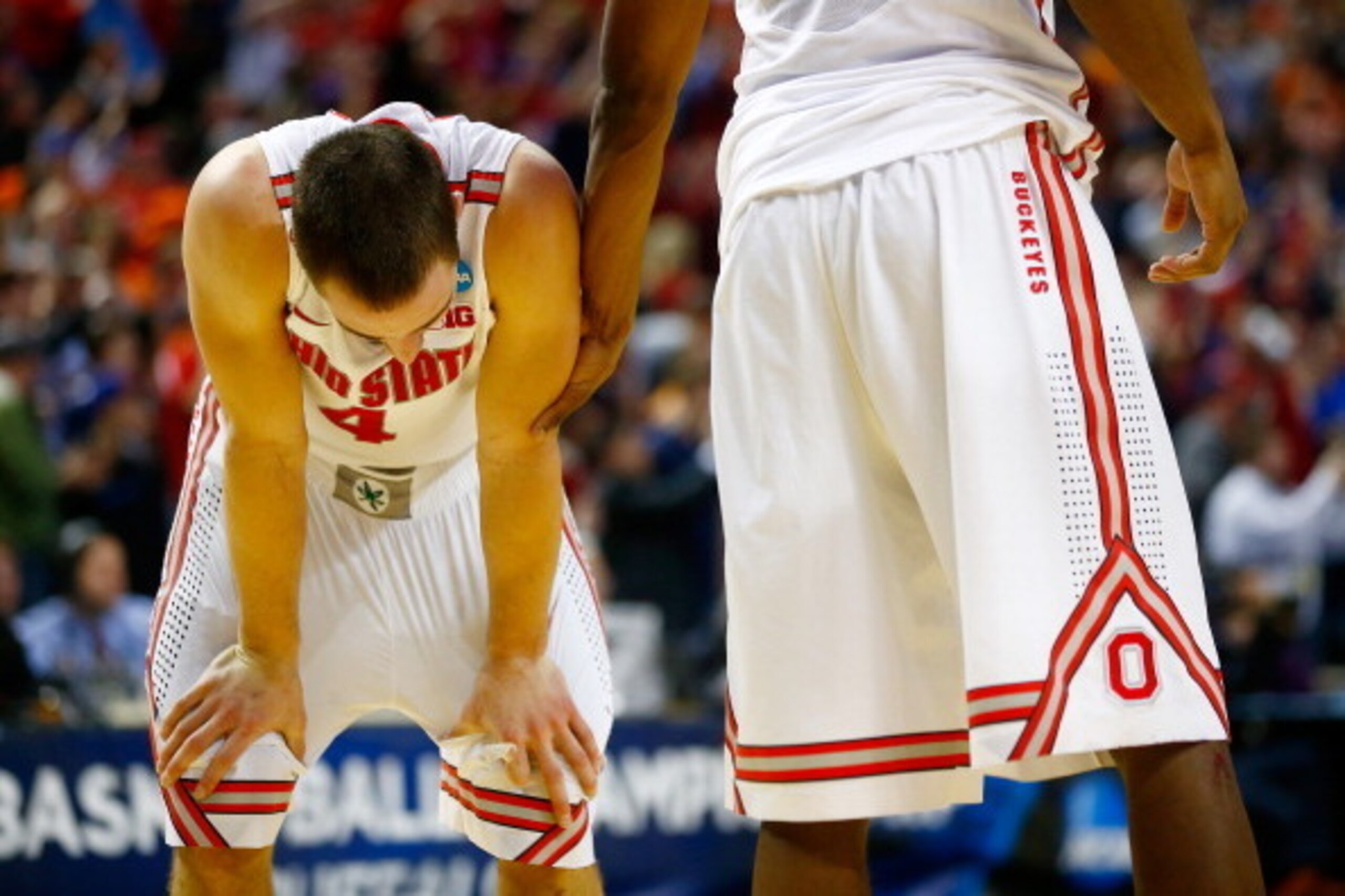 BUFFALO, NY - MARCH 20: Aaron Craft #4 of the Ohio State Buckeyes reacts after losing to the Dayton Flyers 60-59 in the second round of the 2014 NCAA Men's Basketball Tournament at the First Niagara Center on March 20, 2014 in Buffalo, New York.  (Photo b