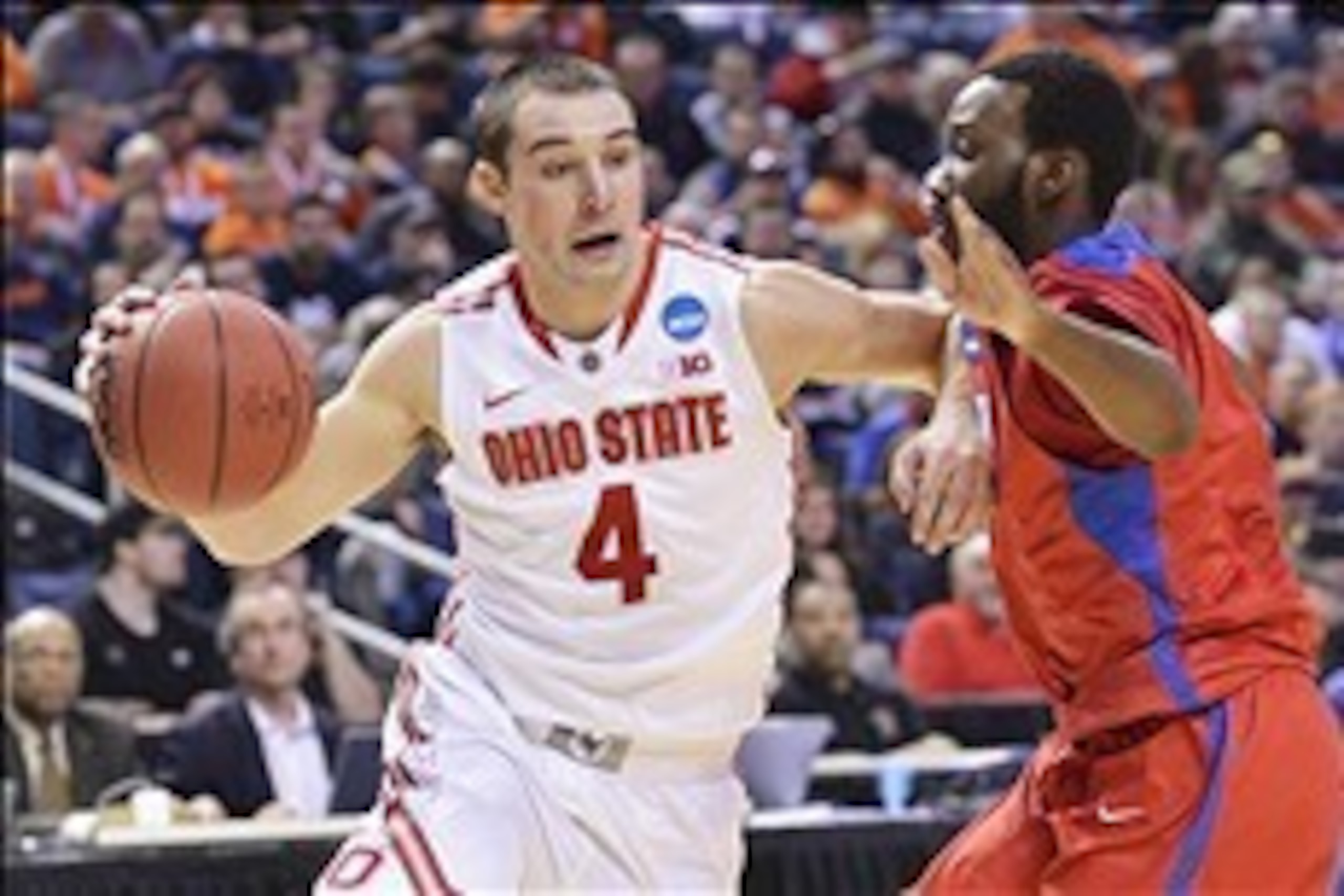 Mar 20, 2014; Buffalo, NY, USA;Ohio State Buckeyes guard Aaron Craft (4) drives to the basket against Ohio State Buckeyes in the second half of a men's college basketball game during the second round of the 2014 NCAA Tournament at First Niagara Center. Ma