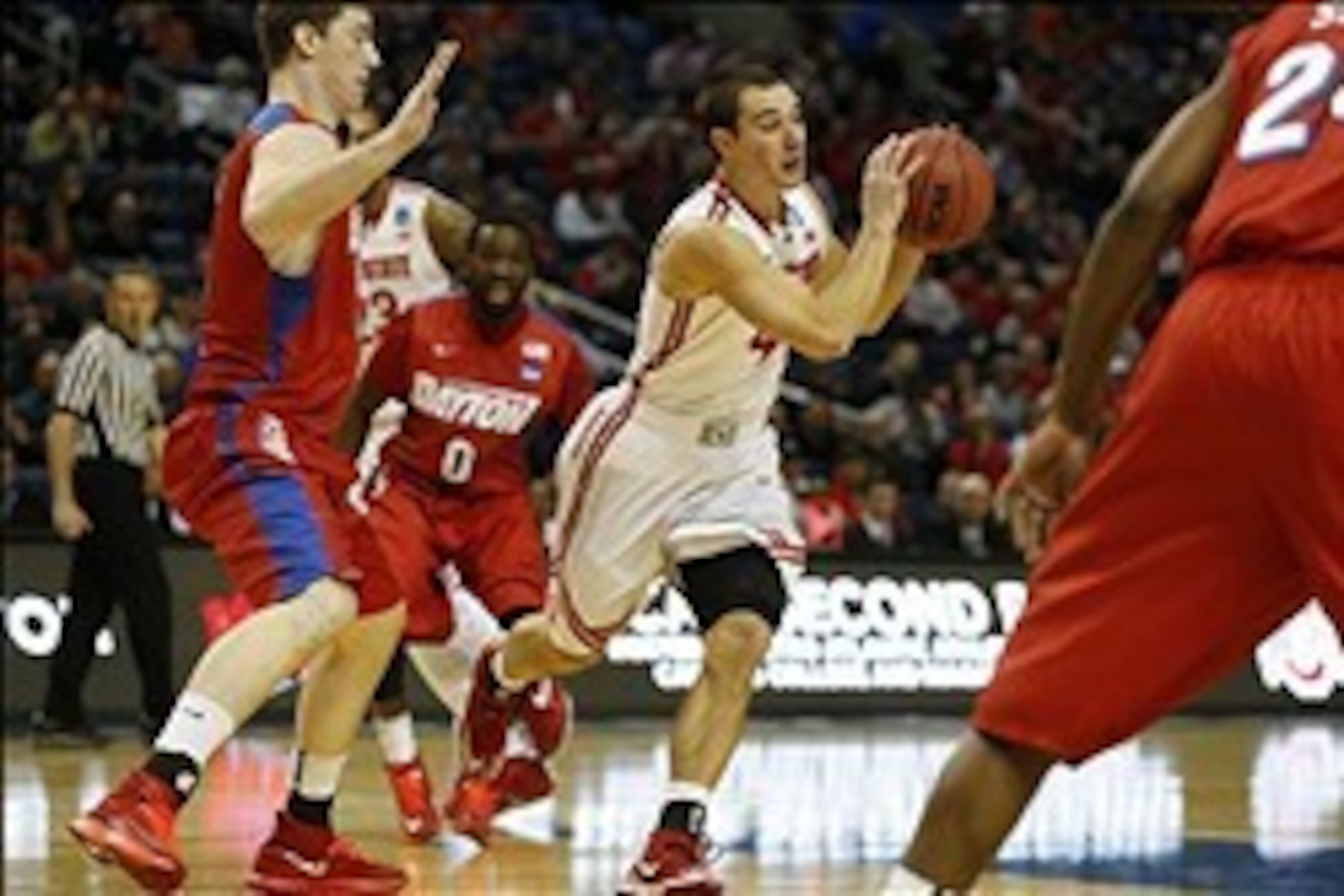 Mar 20, 2014; Buffalo, NY, USA;  Ohio State Buckeyes guard Aaron Craft (4) looks to pass against the Ohio State Buckeyes in the first half of a men's college basketball game during the second round of the 2014 NCAA Tournament at First Niagara Center. Mand