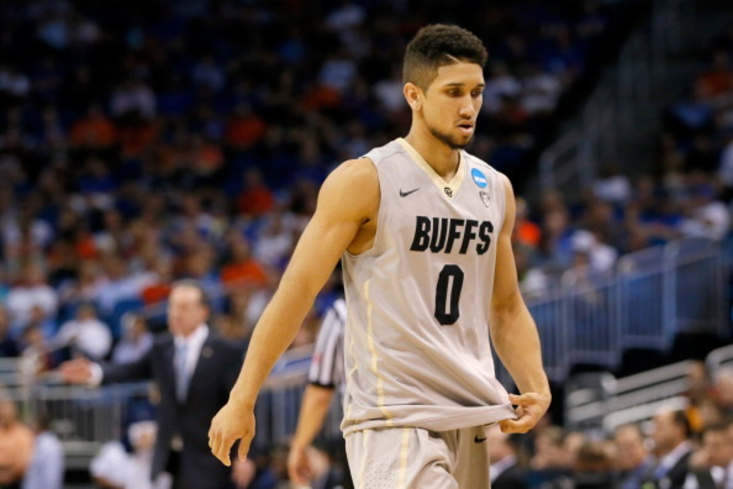 ORLANDO, FL - MARCH 20:  Askia Booker #0 of the Colorado Buffaloes walks off the court in the second half against the Pittsburgh Panthers during the second round of the 2014 NCAA Men's Basketball Tournament at Amway Center on March 20, 2014 in Orlando, Fl