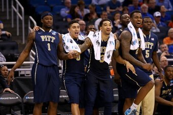 ORLANDO, FL - MARCH 20:  Jamel Artis #1, James Robinson #0, Cameron Wright #3, Cameron Wright #3 and Durand Johnson #5 of the Pittsburgh Panthers celebrate late in the second half while taking on the Colorado Buffaloes during the second round of the 2014 